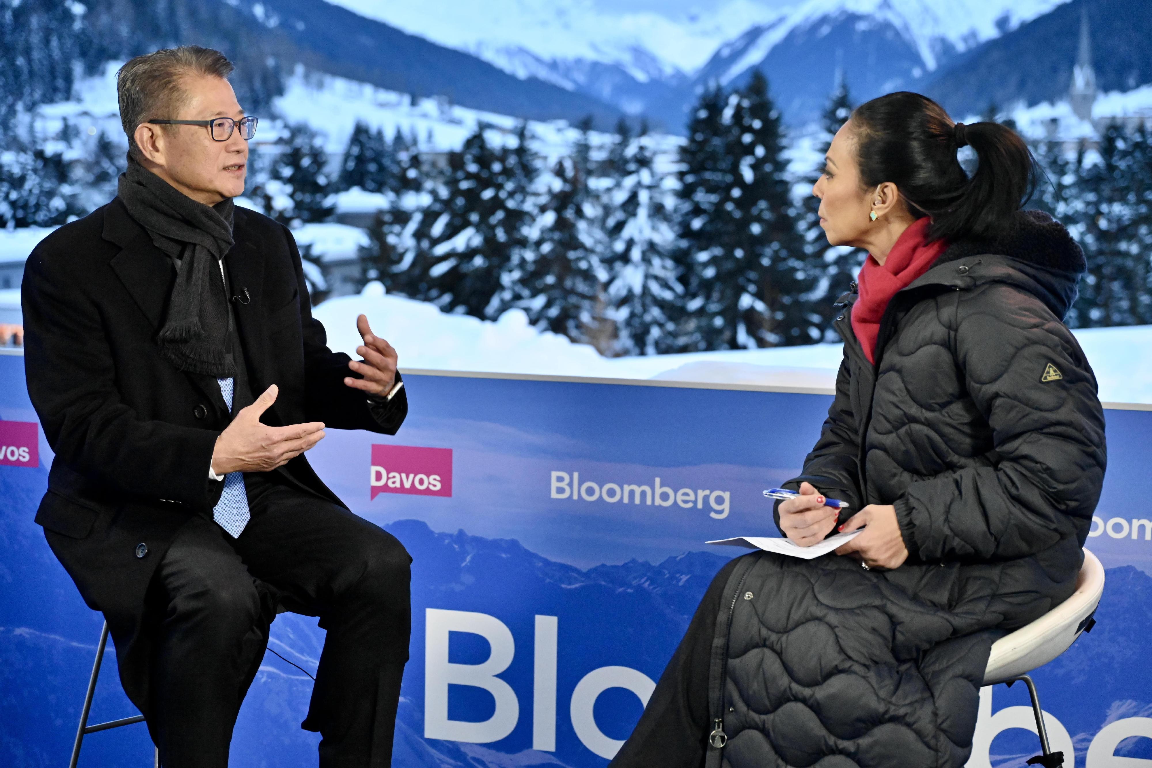 The Financial Secretary, Mr Paul Chan, continued his visit to Davos, Switzerland, yesterday (January 17, Davos time). Photo shows Mr Chan (left) being interviewed by Bloomberg.
