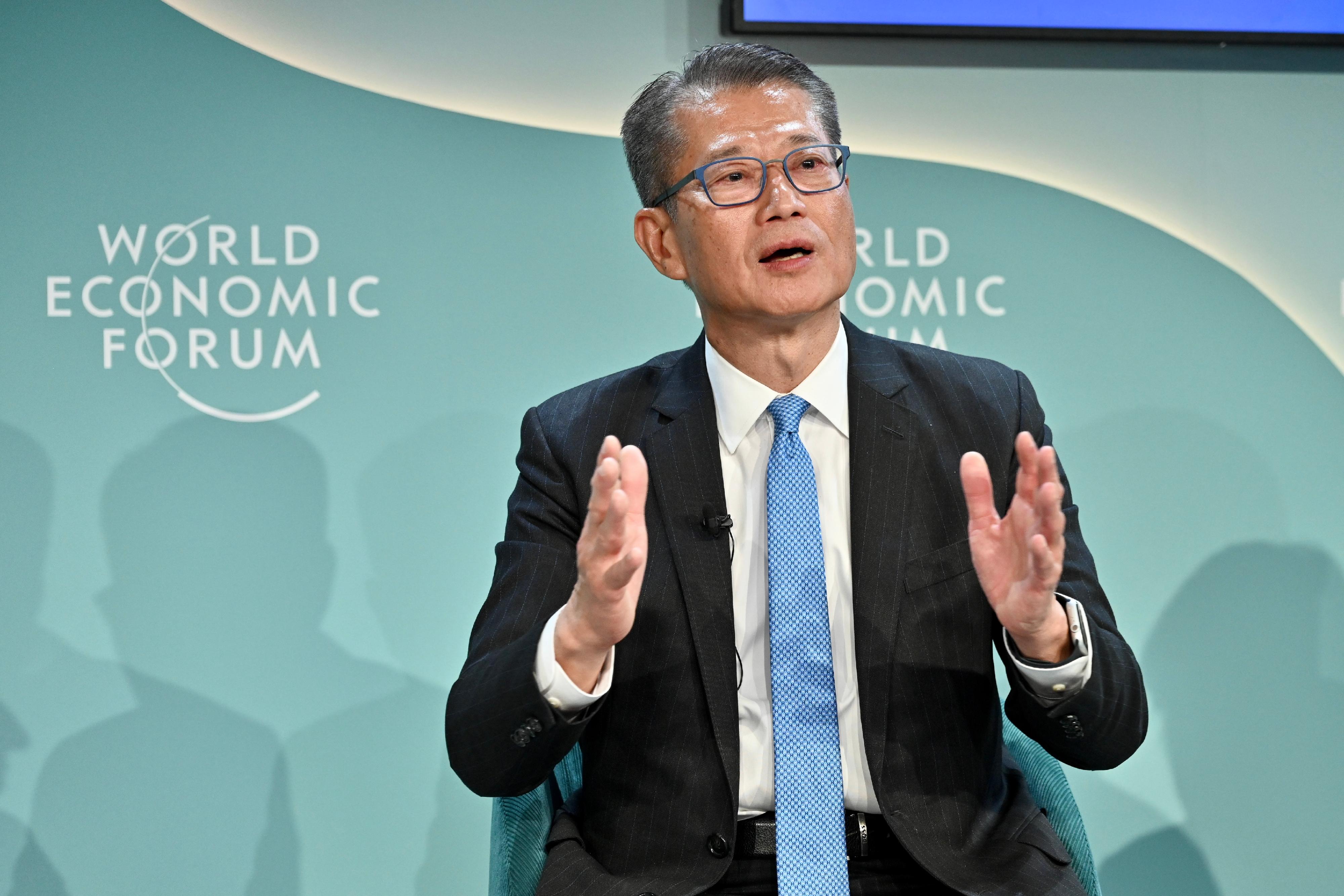 The Financial Secretary, Mr Paul Chan, participated in a thematic discussion session focusing on community development at the World Economic Forum Annual Meeting at Davos, Switzerland, yesterday (January 18, Davos time). Photo shows Mr Chan (centre) speaking at the session. 
