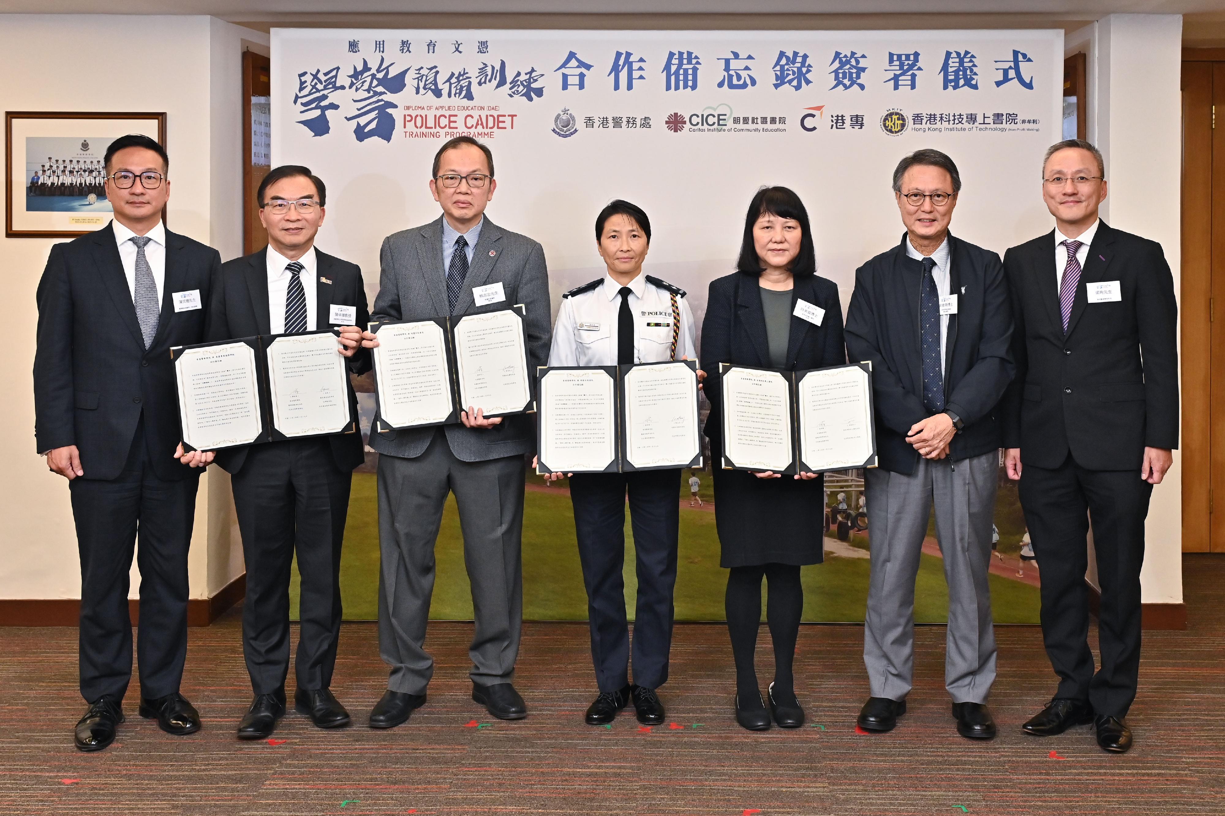 The Hong Kong Police College announced today (January 19) that it will co-organise the “Diploma of Applied Education - Police Cadet Training” Programme with Caritas Institute of Community Education (CICE), Hong Kong College of Technology (HKCT) and Hong Kong Institute of Technology (HKIT) in the 2024/25 academic year. Photo shows (from left) the Assistant Commissioner of Police (Personnel), Mr Chan Man-tak; the President of HKCT, Dr Chan Cheuk-hay; the Principal of CICE, Mr Hung Chi-chung; the Senior Superintendent of Police, School of Foundation Training, Ms Tsang Chiu-tong; the President of HKIT, Dr Shi Mei-chun; Programme Director of Diploma of Applied Education of the Federation for Self-financing Tertiary Education, Dr Simon Leung; and the Acting Director of the Hong Kong Police College, Mr Leung Shun, at the Memorandum of Understanding signing ceremony.