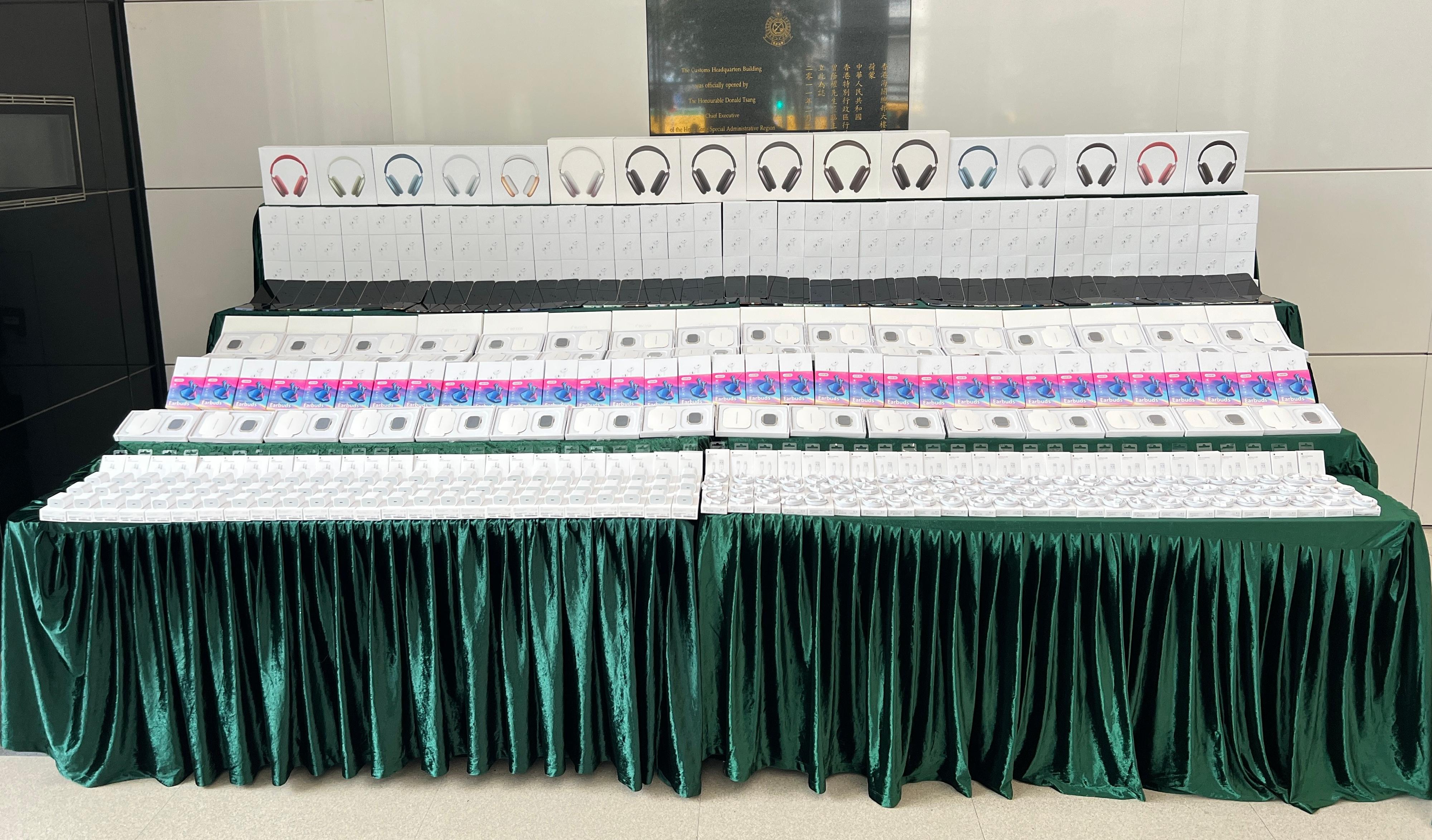 Hong Kong Customs conducted a two-week enforcement operation from January 8 to 19 to combat counterfeit electronic goods activities involving cross-boundary transhipments. During the operation, Customs detected 19 related cases and seized more than 14 800 items of suspected counterfeit electronic goods, including earphones, mobile phones, computer tablets and electronic watches, with an estimated market value of over $10 million. Photo shows the suspected counterfeit electronic goods seized.