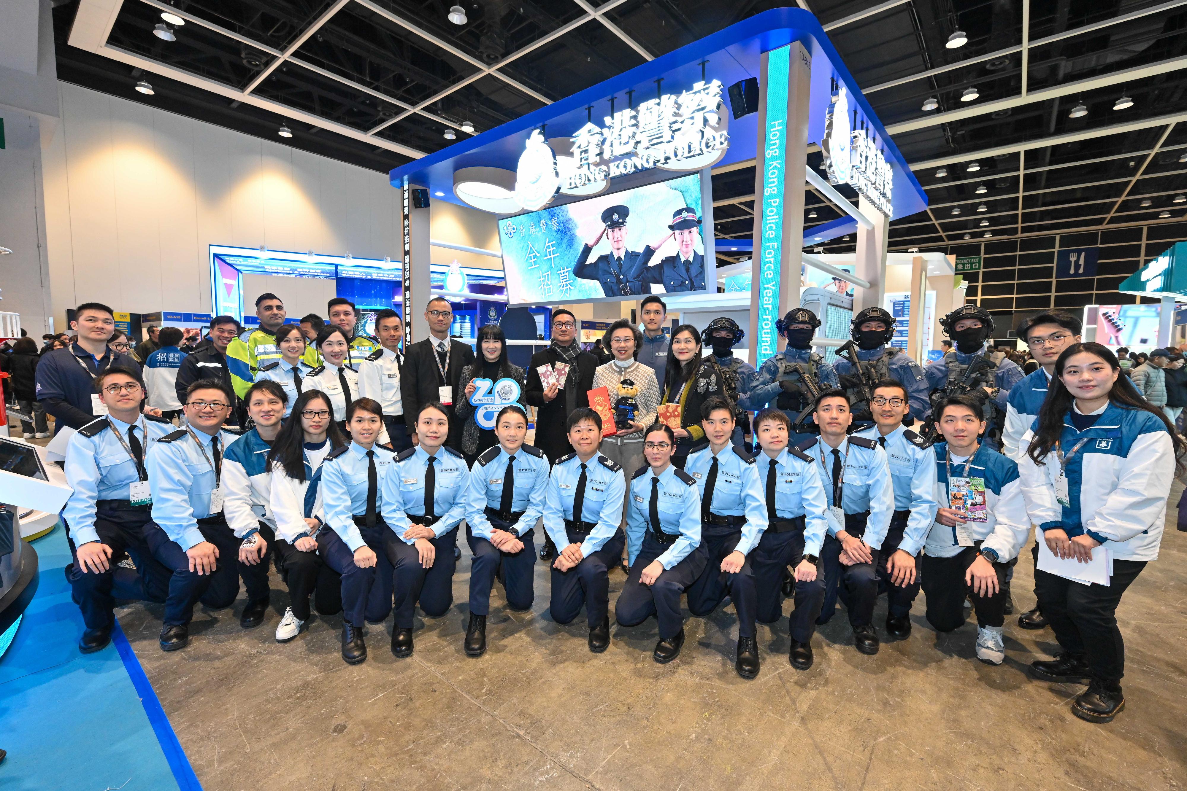 The Civil Service Bureau and various government bureaux and departments have set up booths at the Education & Careers Expo 2024 at the Hong Kong Convention and Exhibition Centre from today (January 25) for four consecutive days to publicise the work and related information of different civil service grades to enhance public understanding of the work of government departments and encourage people with aspirations to serve the community to join the civil service. The Secretary for the Civil Service, Mrs Ingrid Yeung (second row, sixth right), is pictured with officers of the Hong Kong Police Force at the department booth. Looking on is the Executive Director of the Hong Kong Trade Development Council, Ms Margaret Fong (second row, eighth right).