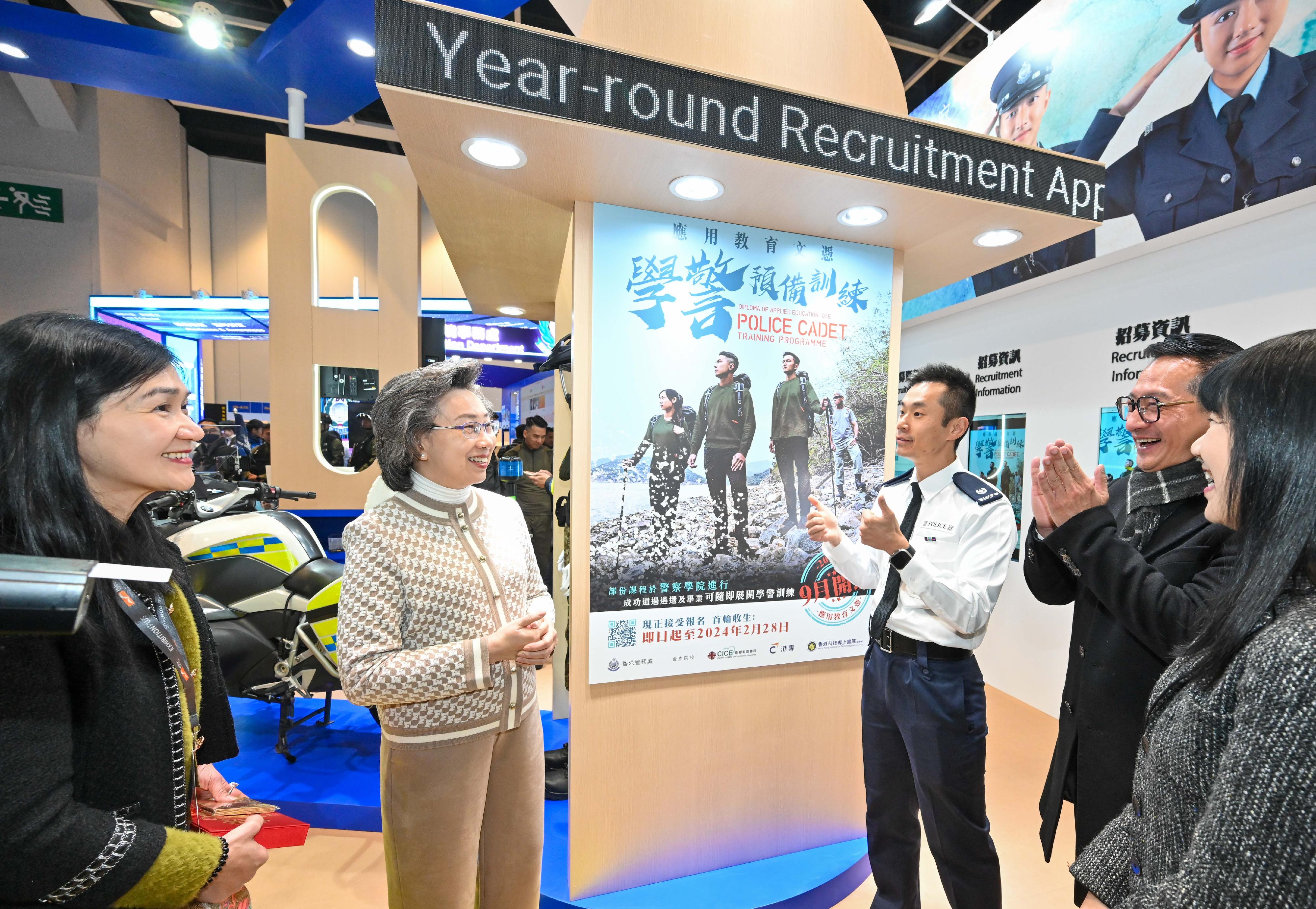 The Civil Service Bureau and various government bureaux and departments have set up booths at the Education & Careers Expo 2024 at the Hong Kong Convention and Exhibition Centre from today (January 25) for four consecutive days to publicise the work and related information of different civil service grades to enhance public understanding of the work of government departments and encourage people with aspirations to serve the community to join the civil service. Photo shows the Secretary for the Civil Service, Mrs Ingrid Yeung (second left), being briefed on the Police Cadet Training Programme by an officer of the Hong Kong Police Force.