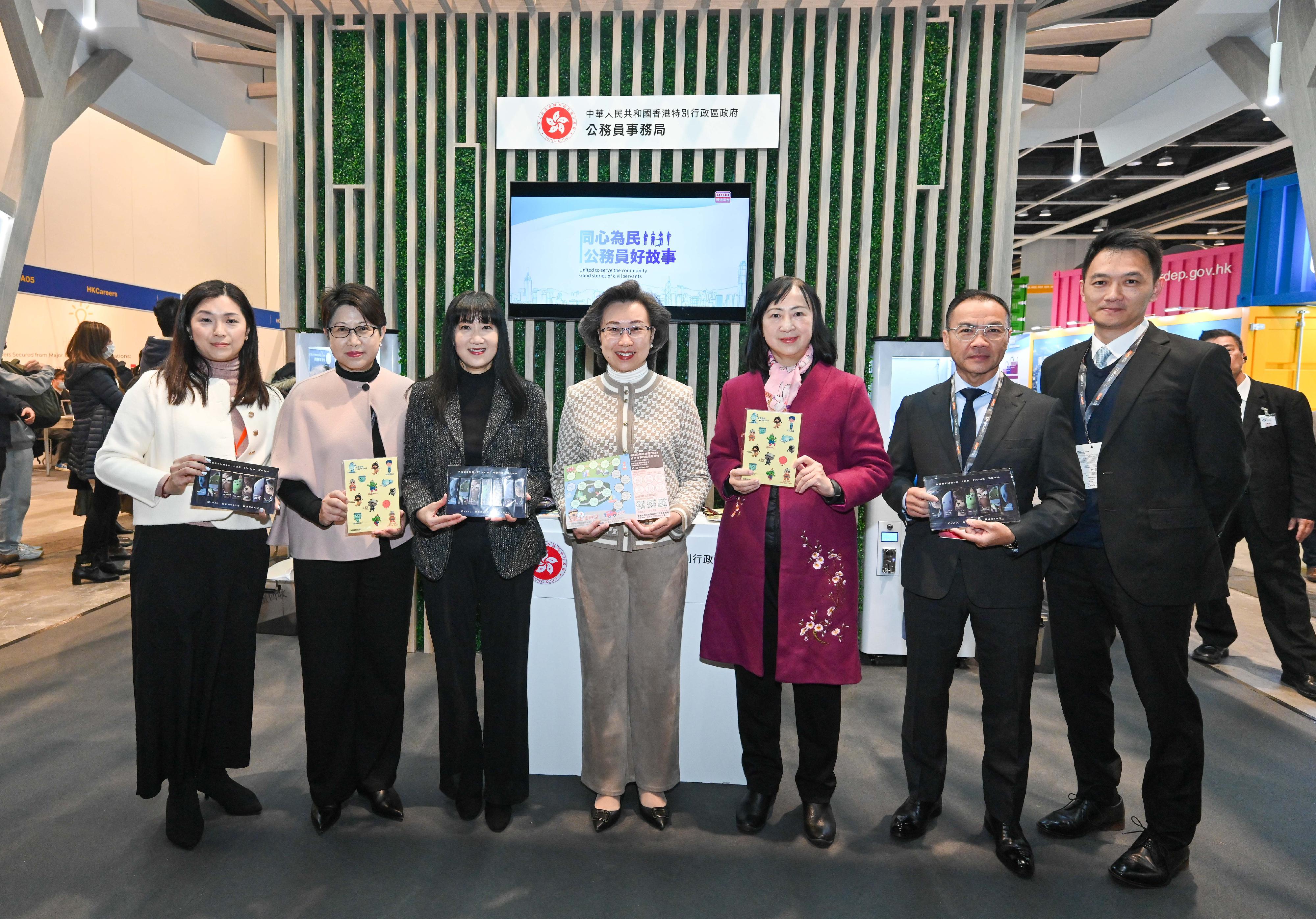 The Civil Service Bureau (CSB) and various government bureaux and departments have set up booths at the Education & Careers Expo 2024 at the Hong Kong Convention and Exhibition Centre from today (January 25) for four consecutive days to publicise the work and related information of different civil service grades to enhance public understanding of the work of government departments and encourage people with aspirations to serve the community to join the civil service. The Secretary for the Civil Service, Mrs Ingrid Yeung (centre), is pictured with the Permanent Secretary for Education, Ms Michelle Li (third right), and the Executive Director of the Hong Kong Trade Development Council, Ms Margaret Fong (third left), at the CSB booth. 