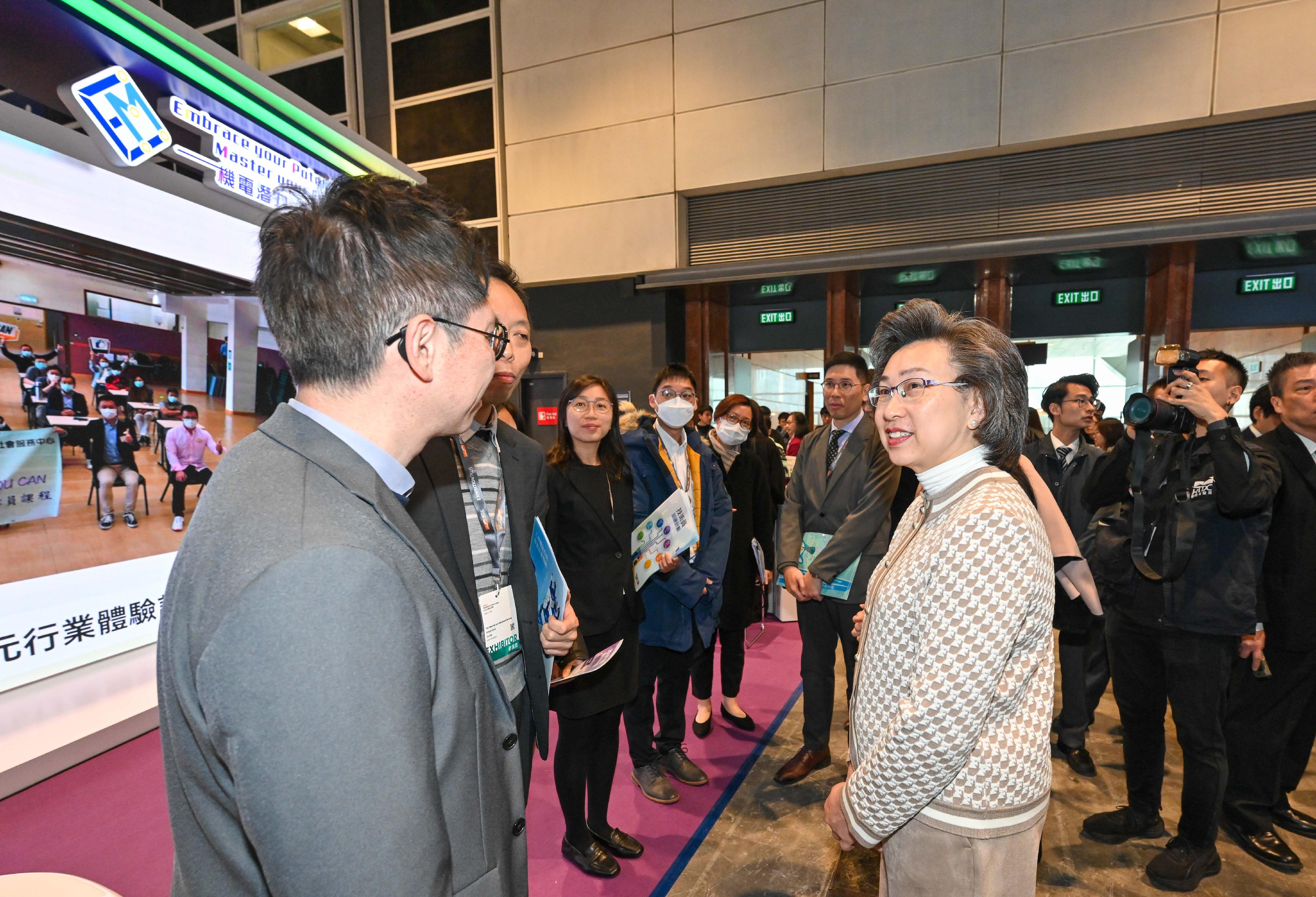 The Civil Service Bureau and various government bureaux and departments have set up booths at the Education & Careers Expo 2024 at the Hong Kong Convention and Exhibition Centre from today (January 25) for four consecutive days to publicise the work and related information of different civil service grades to enhance public understanding of the work of government departments and encourage people with aspirations to serve the community to join the civil service. Photo shows the Secretary for the Civil Service, Mrs Ingrid Yeung (first right), learning about the Technician Training Scheme at the Electrical and Mechanical Services Department booth.