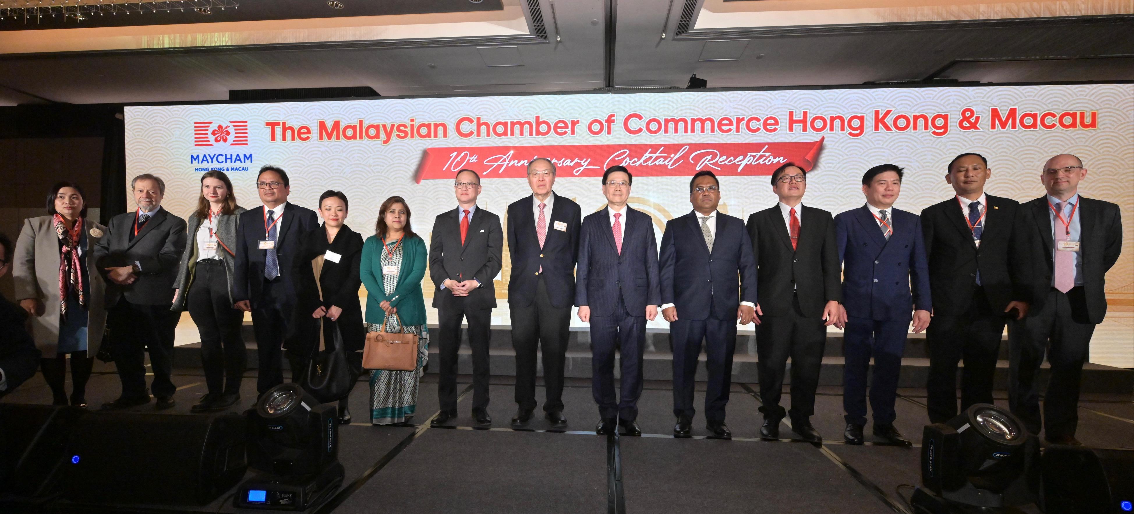The Chief Executive, Mr John Lee, attended the Malaysian Chamber of Commerce Hong Kong & Macau 10th Anniversary Cocktail Reception today (January 25). Photo shows (from fourth right) the Consul-General of Malaysia in Hong Kong, Mr Muzambli Markam; the Ambassador of Malaysia to the People's Republic of China, Dato' Norman Muhamad; Mr Lee; the Chairman of the Malaysian Chamber of Commerce (Hong Kong & Macau), Dato' Gan Khai Choon; and other guests at the reception.