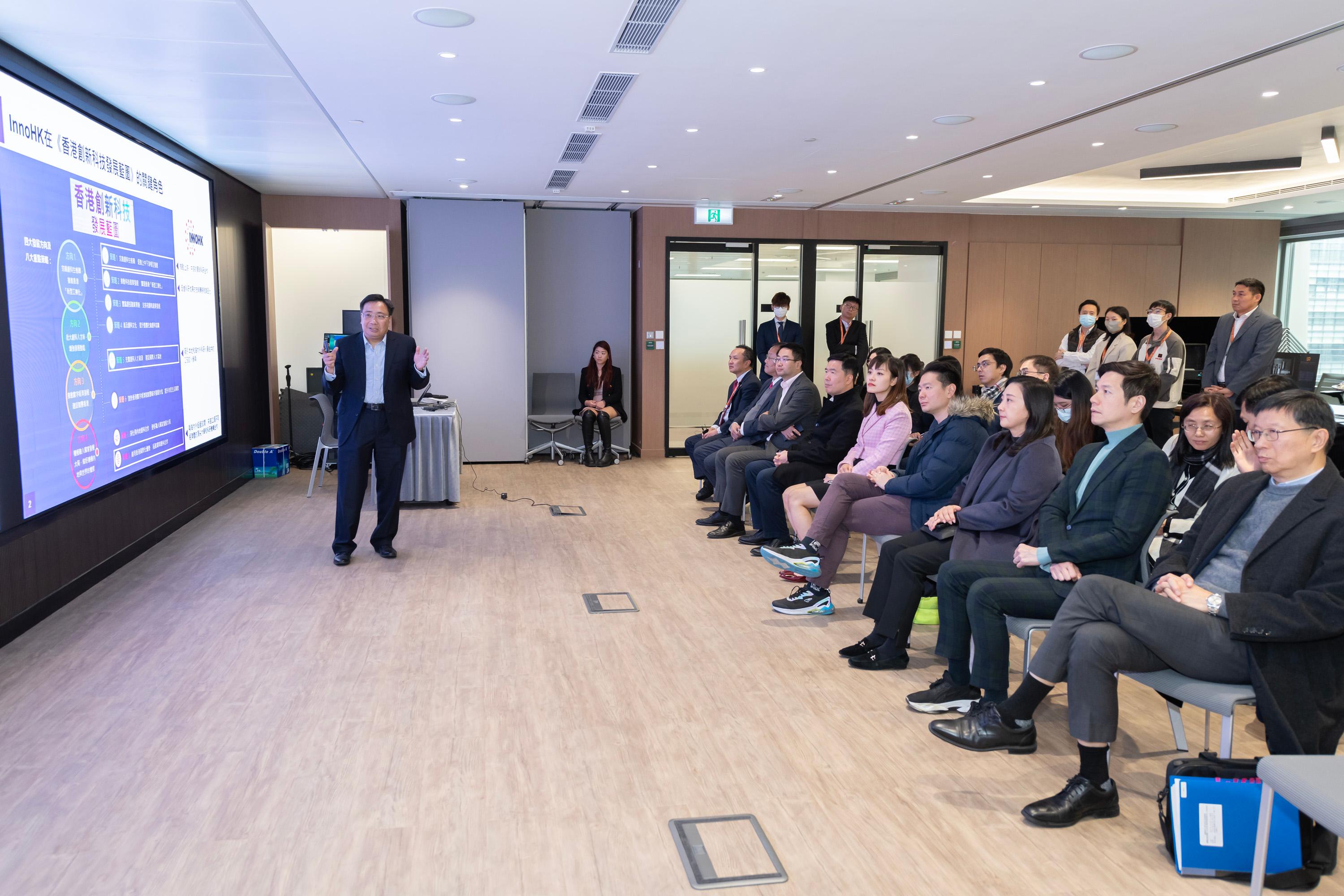 The Legislative Council Subcommittee on Matters Relating to the Promotion of New Industrialization visited the InnoHK Research Clusters (InnoHK) today (January 29). Photo shows Members receiving a briefing on the development of InnoHK.