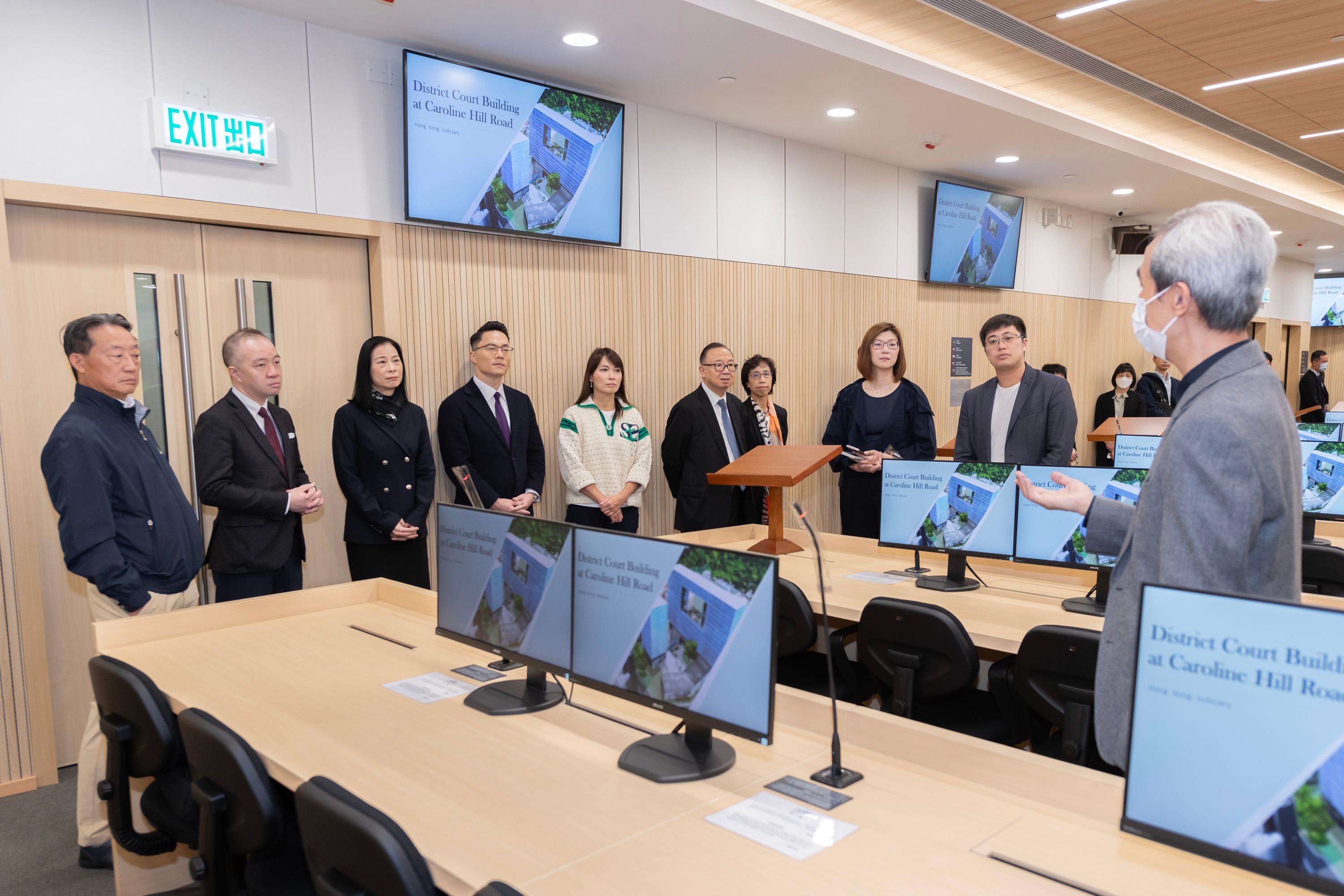 LegCo Panel on Administration of Justice and Legal Services visits the New Mega Courtroom at the Wanchai Law Courts Building today (February 2). Photo shows LegCo Members receiving a briefing from the representatives of the Judiciary on the proposed information technology and audio-visual infrastructure provisions at the new District Court Building.
