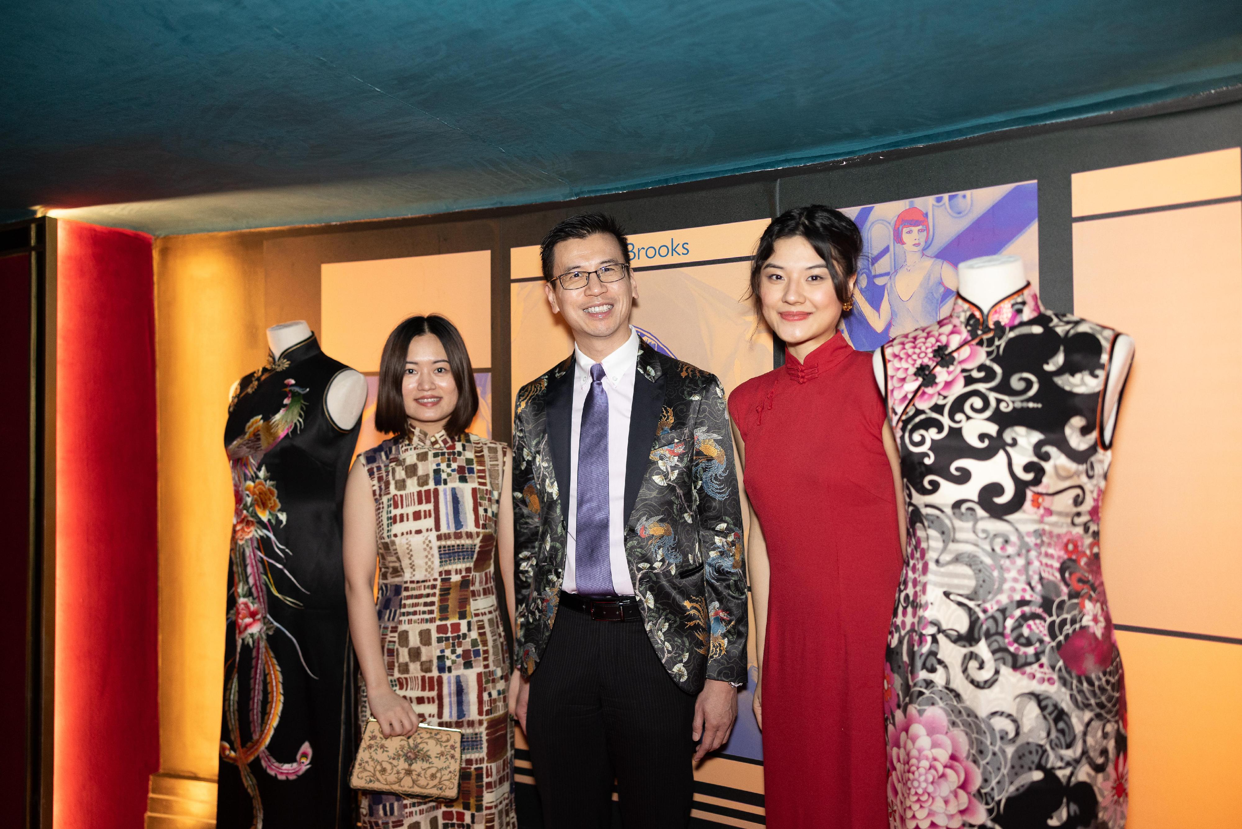 The Hong Kong Economic and Trade Office, London (London ETO) supported the Chinese Cinema Project in staging an immersive screening of "In the Mood for Love" in London, the United Kingdom, on February 3 (London time) to showcase Hong Kong’s unique culture. Photo shows (from left) Founder and Lead Curator of the Chinese Cinema Project, Ms Millie Zhou; the Director-General of London ETO, Mr Gilford Law and Film Curator, Chinese Cinema Project, Ms Yao Tu touring the cheongsam exhibition.