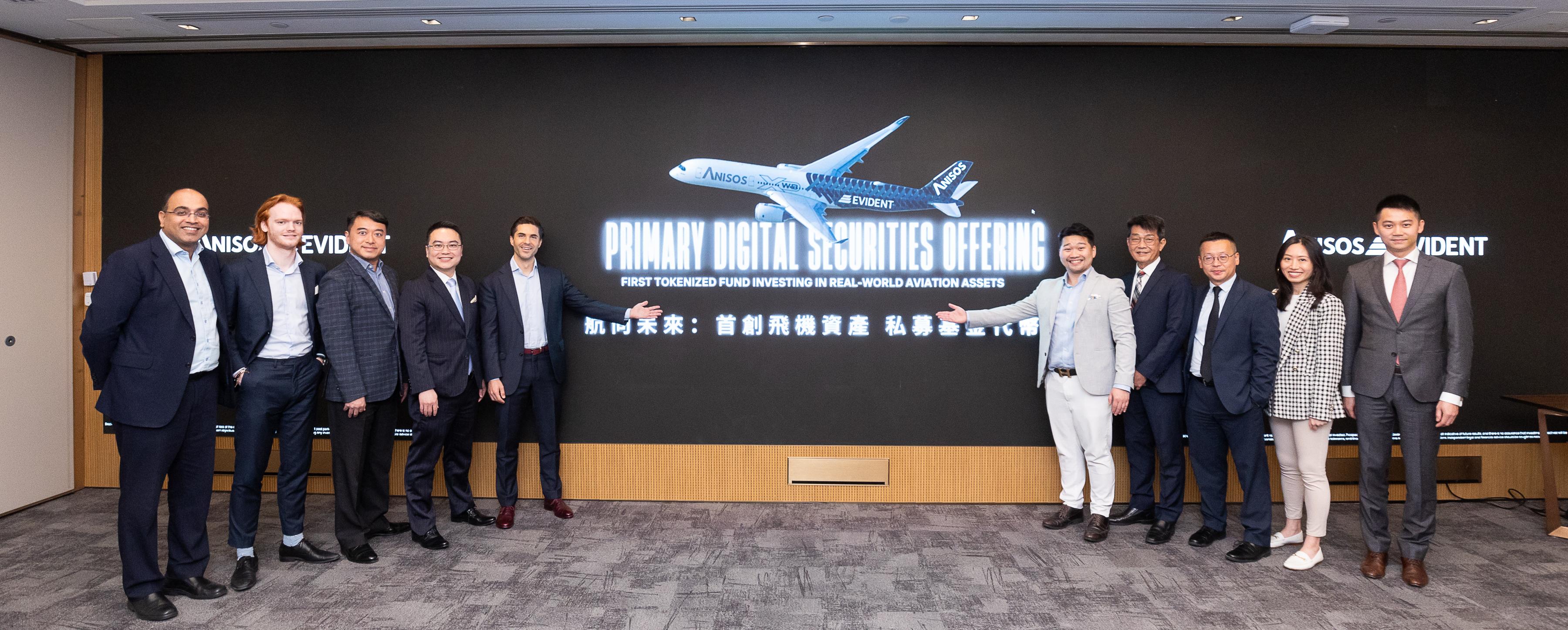 Invest Hong Kong announced today (February 5) that it has assisted a licensed fintech company, Evident Platform Services Limited (EVIDENT), to set up its global headquarters in Hong Kong, offering the world's first tokenised private limited partnership fund investing in the aviation sector, in partnership with Anisos Capital Group. Photo shows (from left) Partner of Tiang & Partners Mr Tejaswi Nimmagadda; the Head of Business Operations, EVIDENT, Mr Thomas Gijsels; the Head of Fund Admin and Custody, EVIDENT, Mr Kenneth Li; the Head of Investment Solutions, EVIDENT, Mr Manton Wai; the Founder and CEO, EVIDENT, Dr Florian Spiegl; the CEO of Anisos Capital Group, Mr Steven Dominique Cheung; the COO of Anisos Capital Group, Captain Simon Wu; the Managing Director, Prosynergy, Mr Louie Lee; and the CFO of Anisos Capital Group, Mr Howard Cheung (first right) at the opening. 