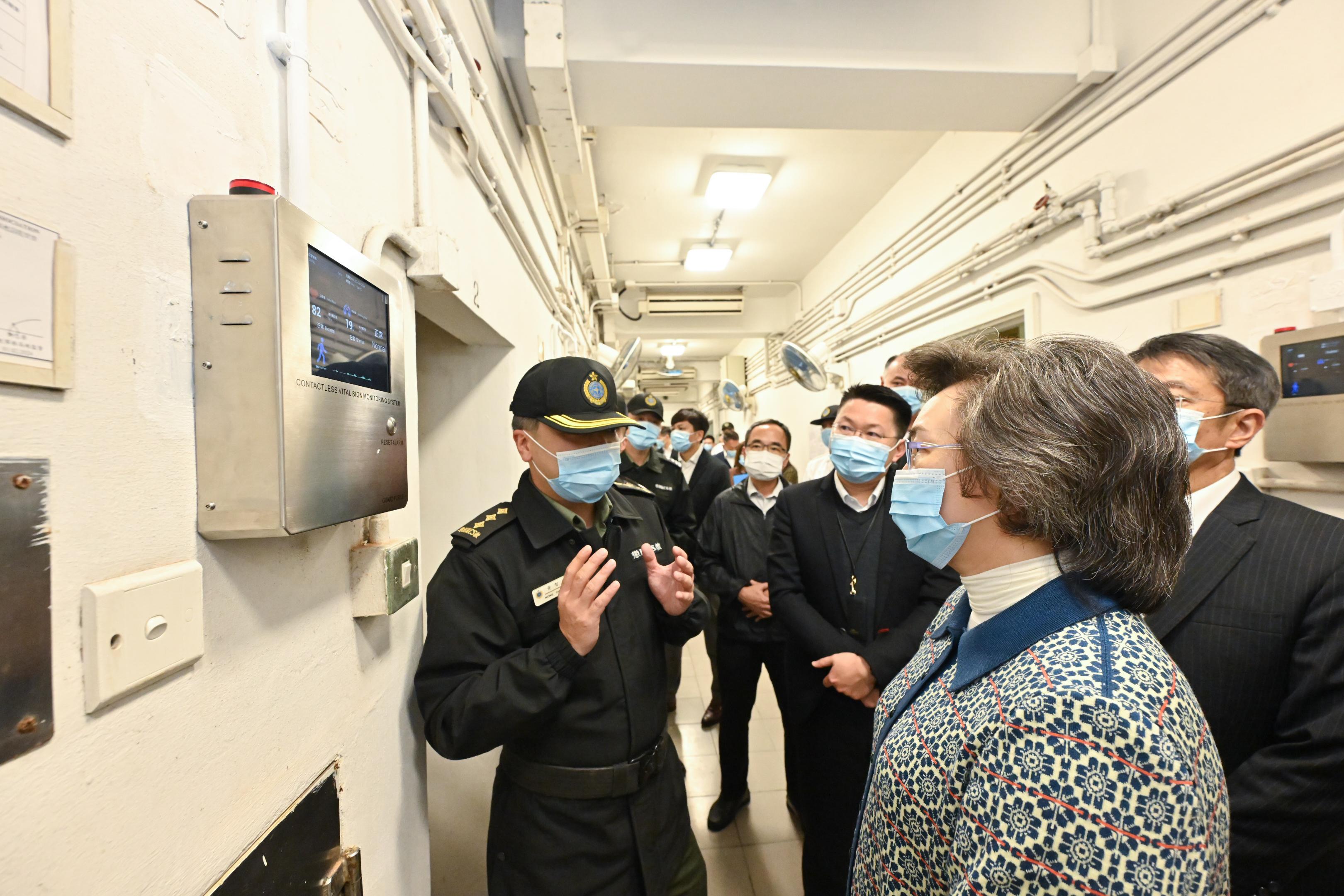 The Secretary for the Civil Service, Mrs Ingrid Yeung, visited the Correctional Services Department and toured the Lai Chi Kok Reception Centre today (February 7). Photo shows Mrs Yeung (second right) learning about the application of the Contactless Vital Sign Monitoring System, which is used to monitor the breath and heartbeat of patients in the reception centre’s hospital.