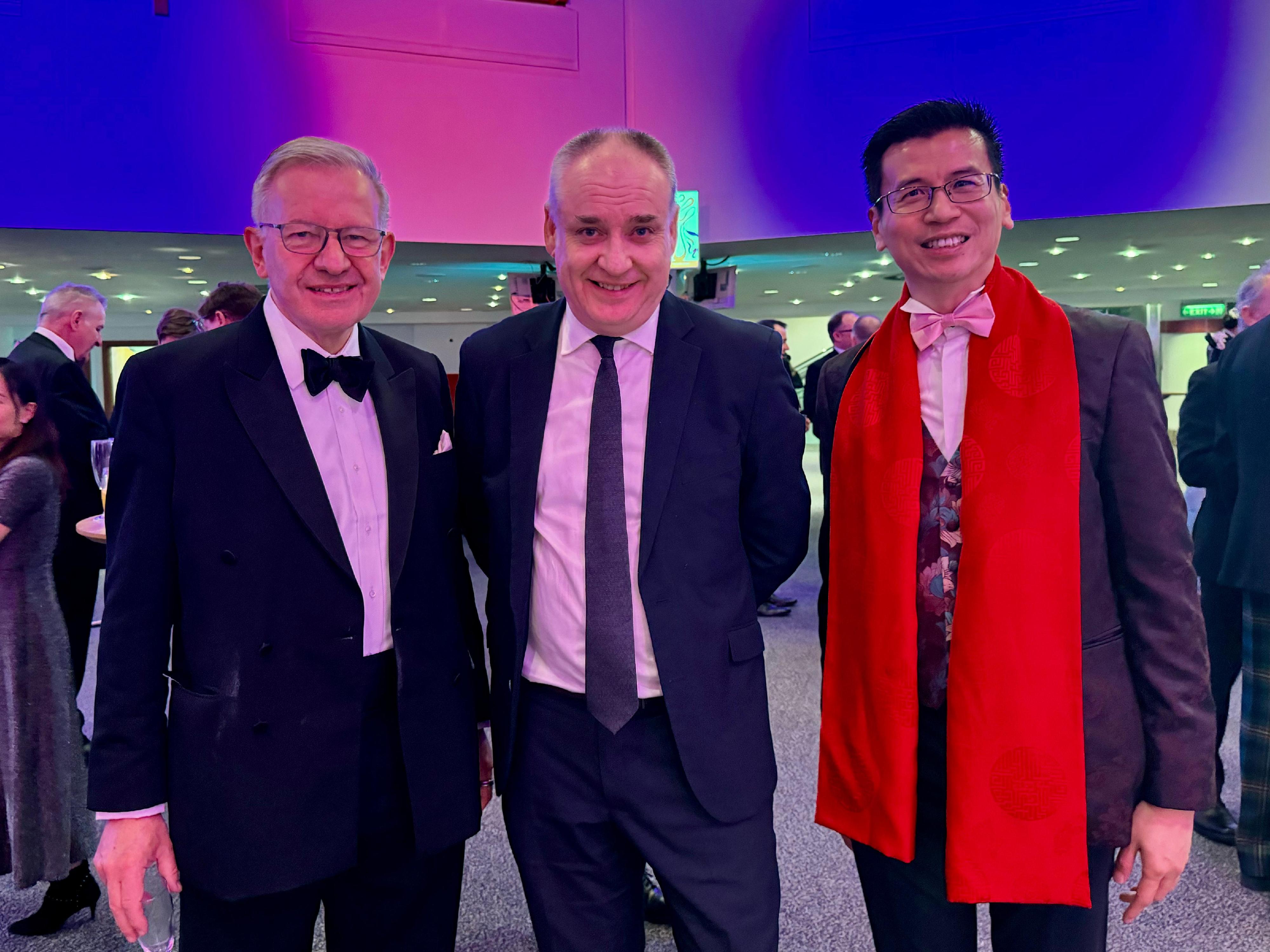 The Hong Kong Economic and Trade Office, London (London ETO) hosted the "Toast to the Dragon" reception in Edinburgh, the United Kingdom, on February 8 (London time). Photo shows (from left) the Chair of the China-Britain Business Council, Sir Sherard Cowper-Coles; the Minister for Small Business, Innovation, Tourism and Trade of the Scottish Government, Mr Richard Lochhead; the Director-General of the London ETO, Mr Gilford Law. 
