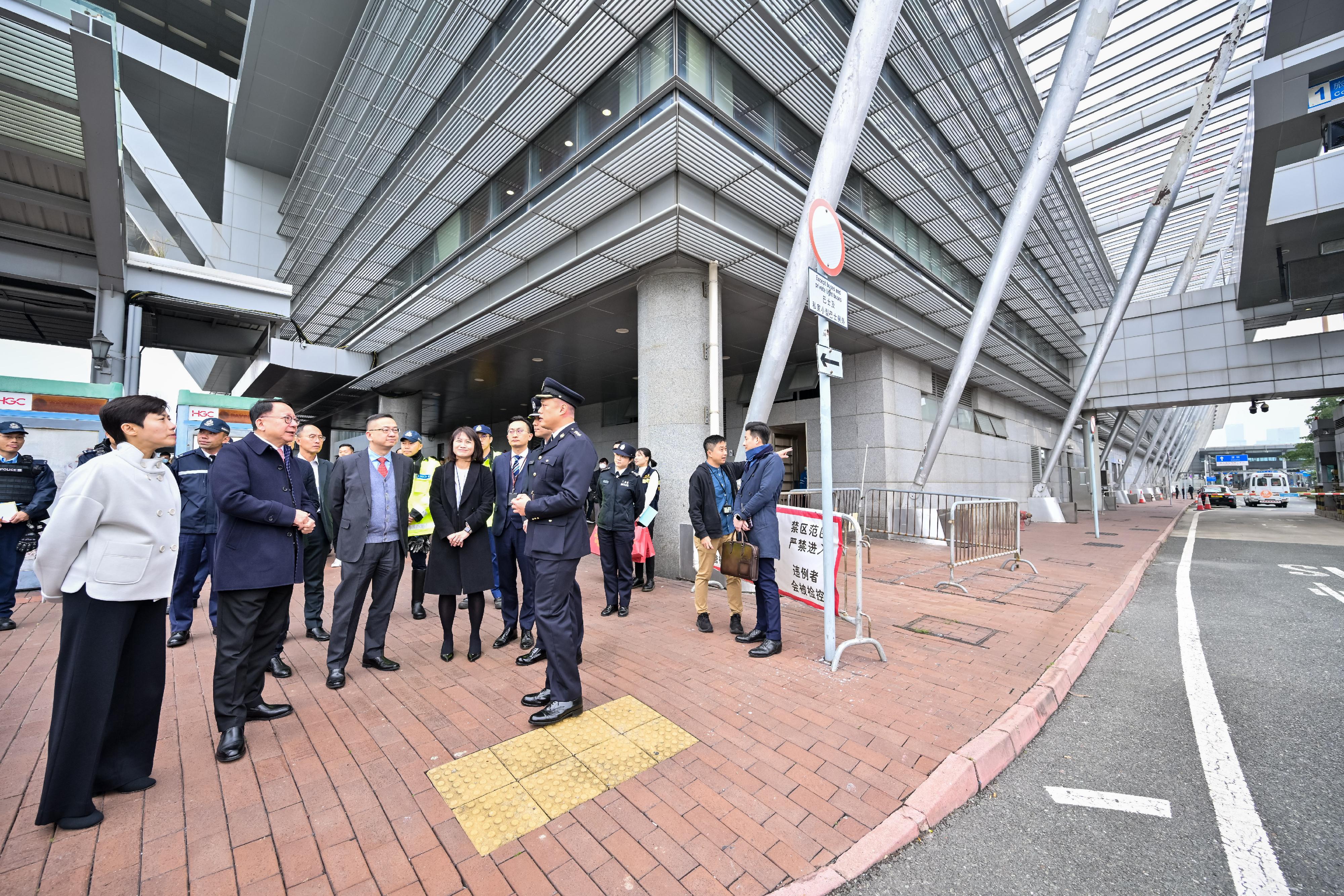 The Chief Secretary for Administration, Mr Chan Kwok-ki (second left), accompanied by the Commissioner of Customs and Excise, Ms Louise Ho (first left), and the Director of Immigration, Mr Benson Kwok (third left), visits the Shenzhen Bay Control Point to inspect its operations and receive a briefing from colleagues of the Immigration Department today (February 10), on the first day of the Lunar New Year. He also thanks all the colleagues who are on duty during the Lunar New Year holidays.