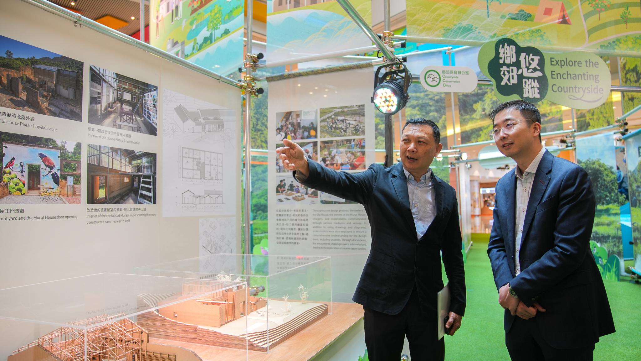 Organised by the Countryside Conservation Office (CCO), the roving exhibition entitled "Explore the Enchanting Countryside" will be launched tomorrow (February 20). It aims to showcase the culture and natural ecology of Hong Kong's countryside areas and encourage the public to explore Hong Kong's beautiful countryside villages. Photo shows the Principal Assistant Secretary for Environment and Ecology (Nature Conservation), Mr Desmond Wu (right), and the Head of the CCO, Professor Stephen Tang (left), visiting the exhibition today (February 19).