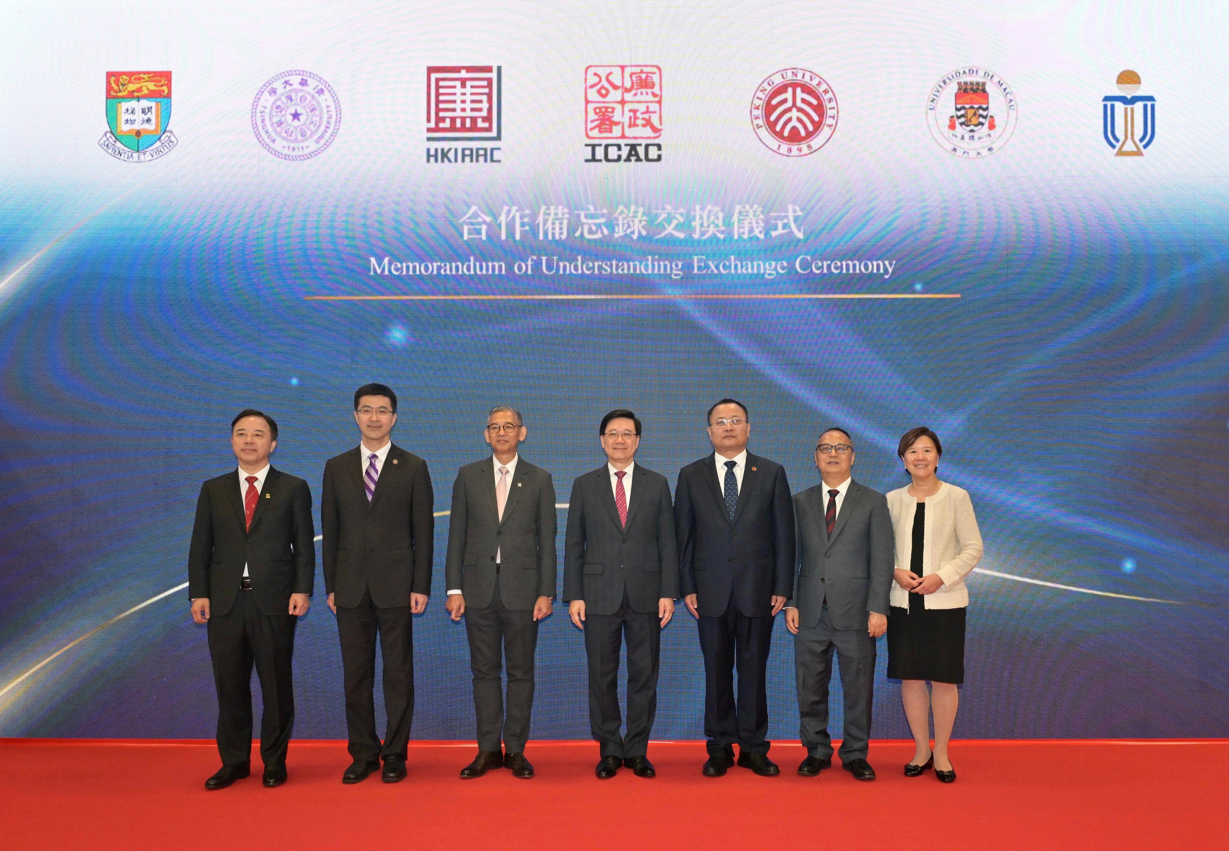 The Chief Executive, Mr John Lee, attended the ICAC (Independent Commission Against Corruption) 50th Anniversary Reception and Establishment Ceremony of Hong Kong International Academy Against Corruption today (February 21). Photo shows Mr Lee (centre), and the Commissioner of the ICAC, Mr Woo Ying-ming (third left), with representatives of collaborating universities who signed a Memorandum of Understanding at the event.