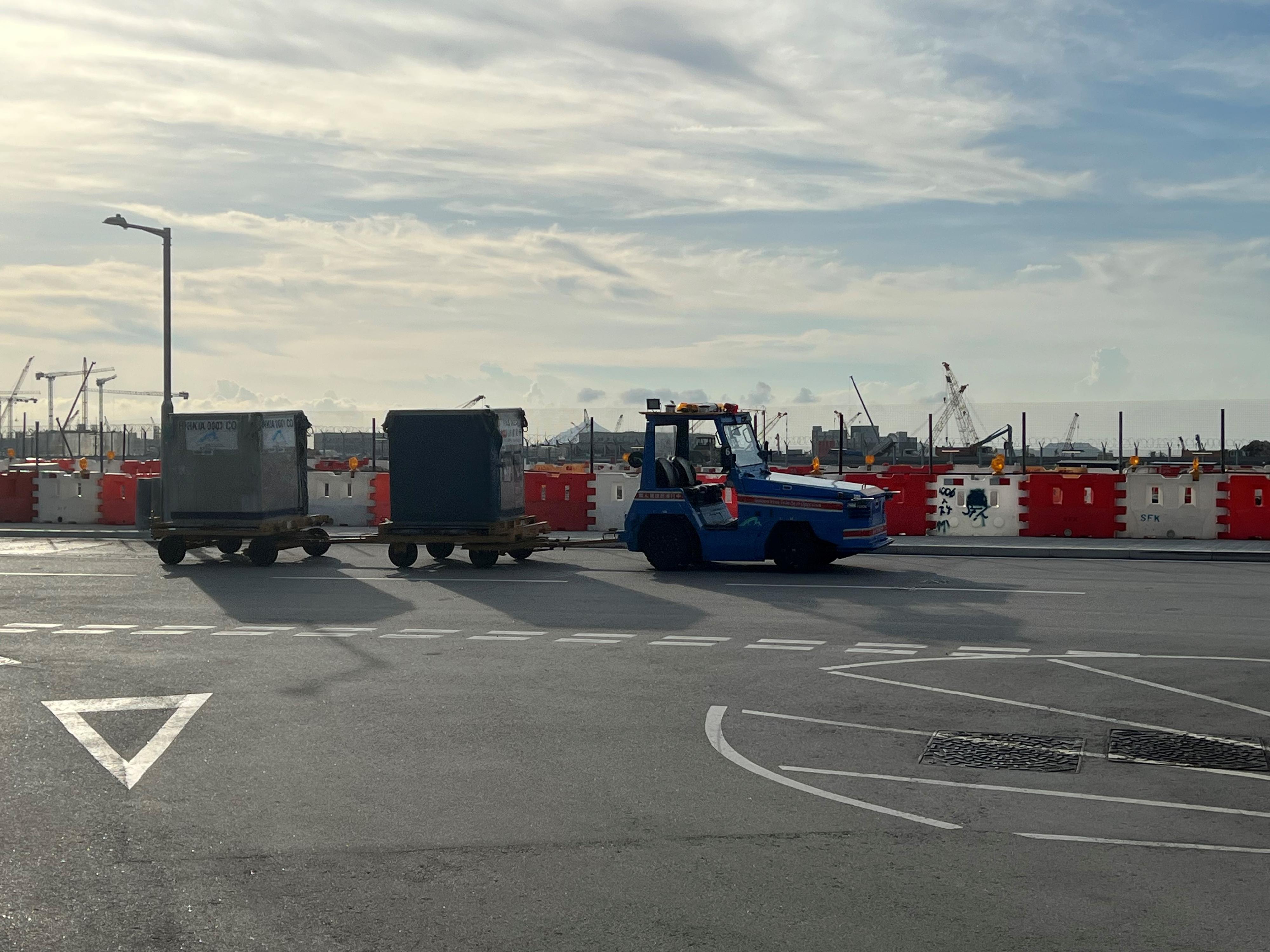 AI driverless technology company UISEE announced it will set up its international headquarters, a research and development centre and a corporate treasury centre in Hong Kong. Photo shows a UISEE autonomous electric tractor transporting baggage from the airport terminal to the SkyPier Terminal.