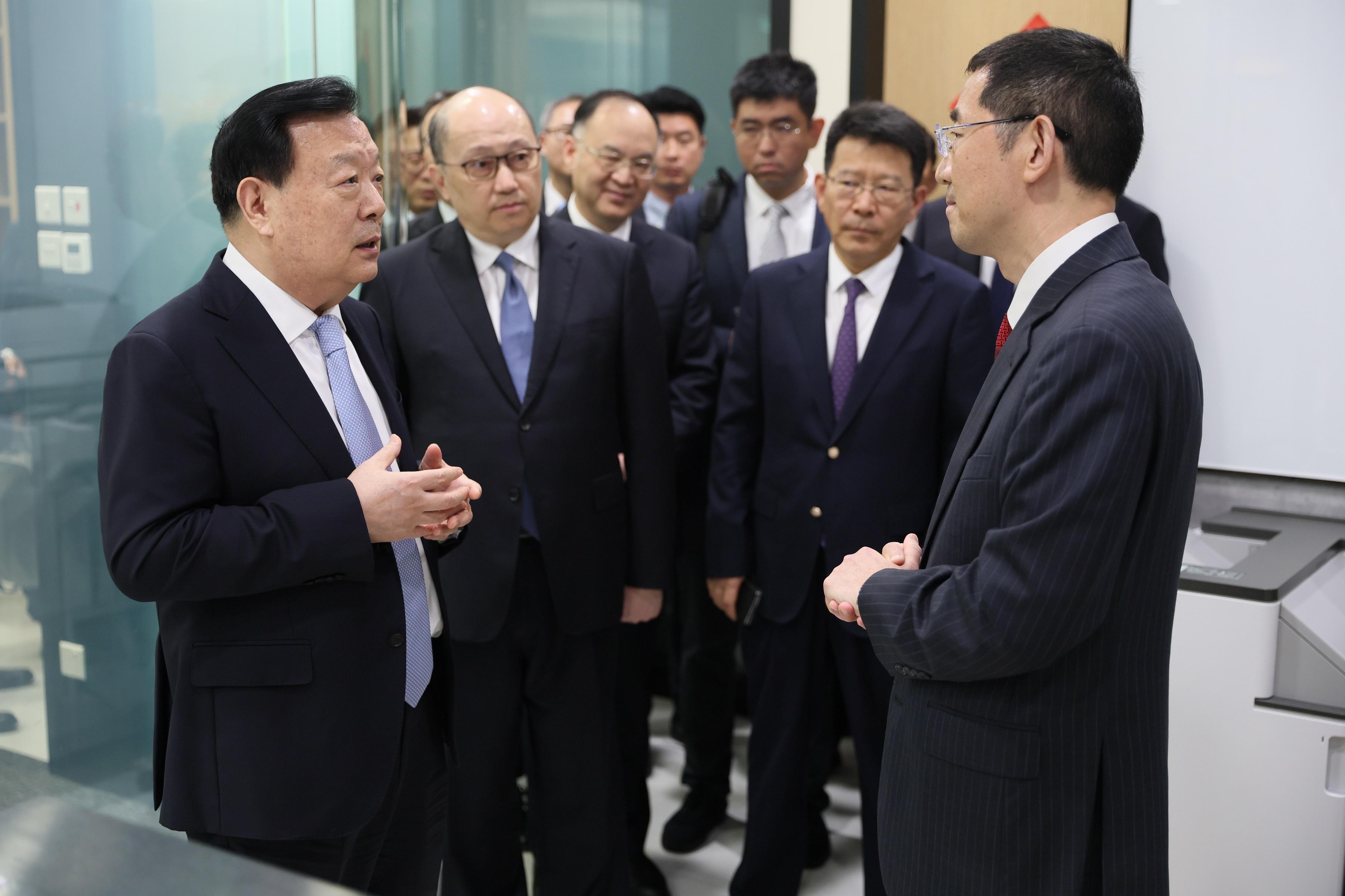 The Director of the Hong Kong and Macao Work Office of the Communist Party of China Central Committee and the Hong Kong and Macao Affairs Office of the State Council, Mr Xia Baolong, continued his inspection visit to Hong Kong today (February 23). Photo shows Mr Xia (first left) inspecting the International Organization for Mediation Preparatory Office and being briefed by the preparatory office’s Director-General, Dr Sun Jin (first right), on the preparatory work and progress of the office.