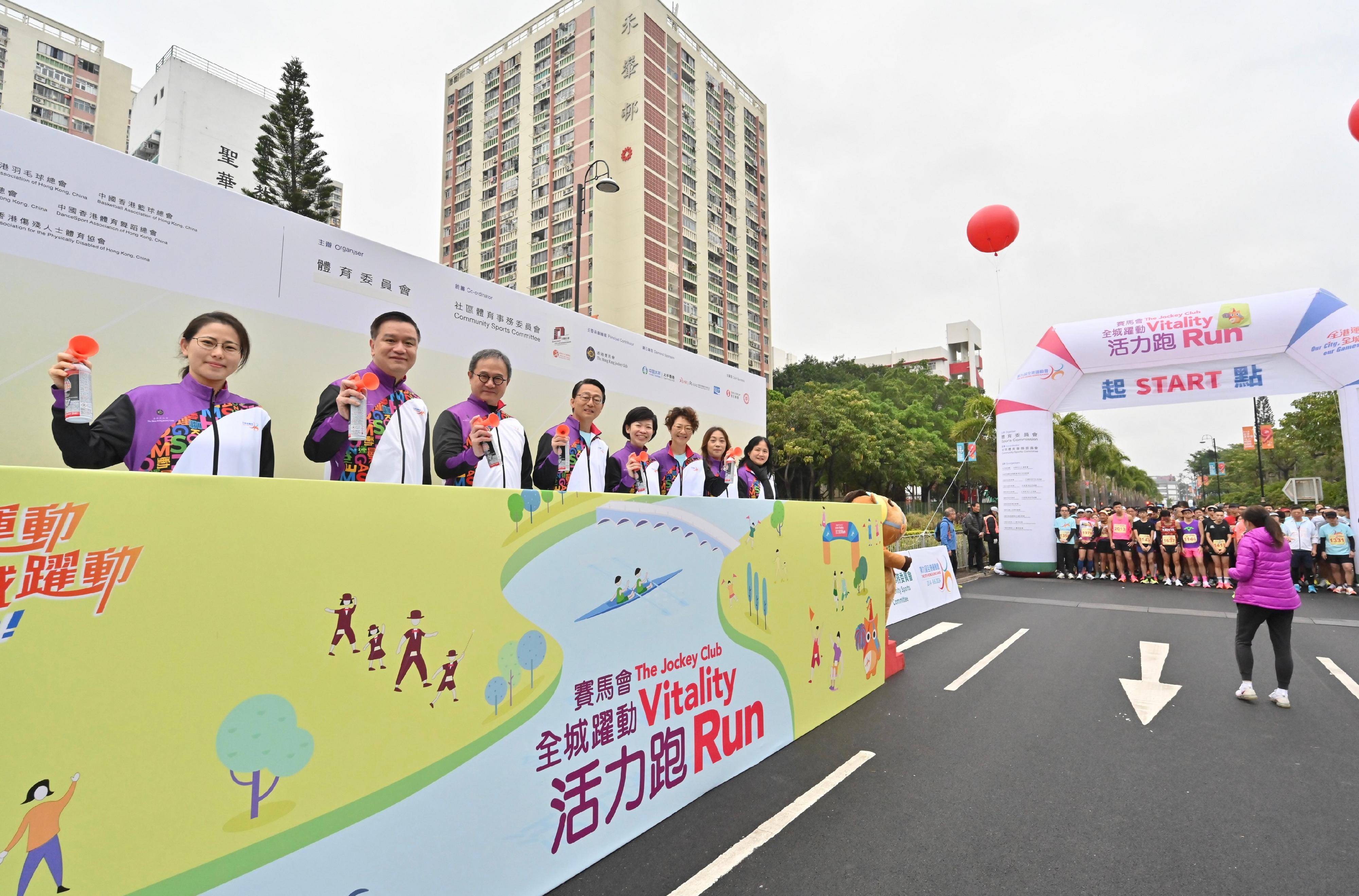 The 9th Hong Kong Games' Jockey Club Vitality Run (HKG) was held alongside the Shing Mun River in Sha Tin this morning (March 3). Officiating guests at the starting ceremony were the Permanent Secretary for Culture, Sports and Tourism, Mr Joe Wong (third left); the Director of Leisure and Cultural Services, Mr Vincent Liu (fourth left); the Chairman of the 9th HKG Organising Committee, Professor Patrick Yung (second left); the Executive Manager of Charities (Sports & Institute of Philanthropy) of the Hong Kong Jockey Club, Ms Donna Tang (fourth right); the Honorary Treasurer of the Hong Kong, China Association of Athletics Affiliates, Ms Irene Chan (first left); and the Deputy Director of Leisure and Cultural Services (Leisure Services), Miss Winnie Chui (third right).
