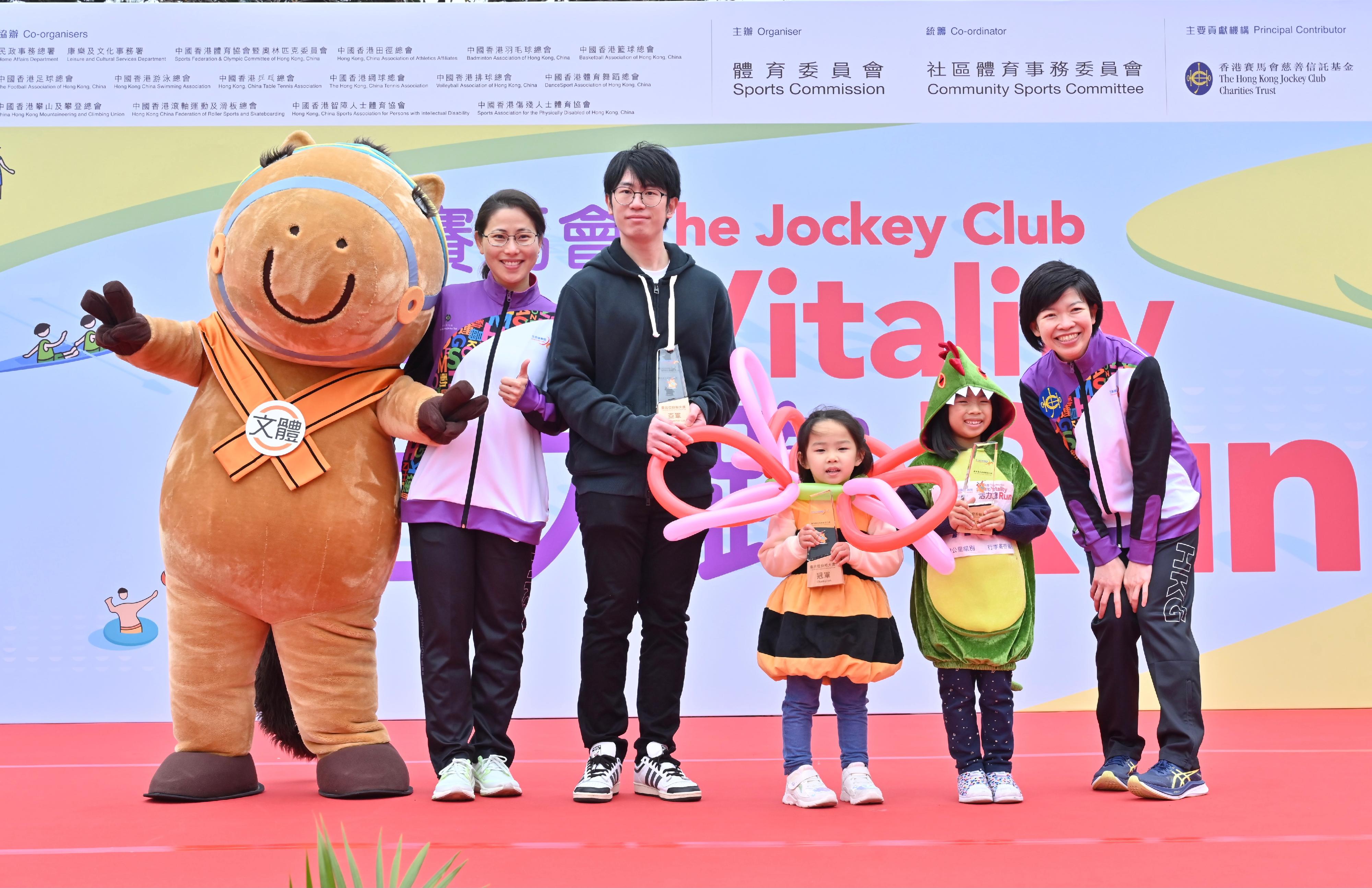 The 9th Hong Kong Games' Jockey Club Vitality Run was held alongside the Shing Mun River in Sha Tin this morning (March 3) , runners dressed up and competed for the Costume Prizes. Photo shows the Executive Manager of Charities (Sports & Institute of Philanthropy) of the Hong Kong Jockey Club, Ms Donna Tang (first right), and the Honorary Treasurer of the Hong Kong, China Association of Athletics Affiliates, Ms Irene Chan (second left), with the champion (third right), the first runner-up (third left) and the second runner-up (second right) of the individual Most Creative Costume Prizes.