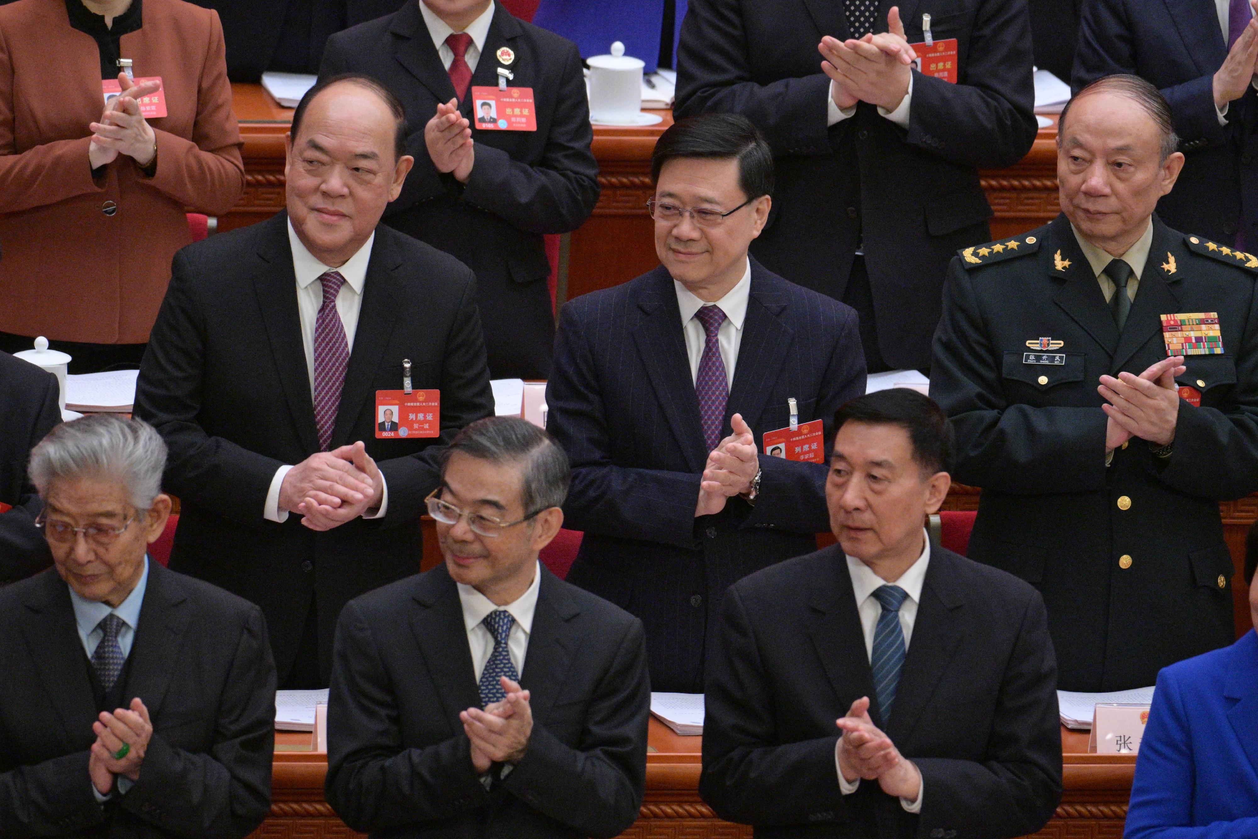 行政长官李家超（第二排中）今日（三月五日）上午在北京列席第十四届全国人民代表大会第二次会议开幕会。