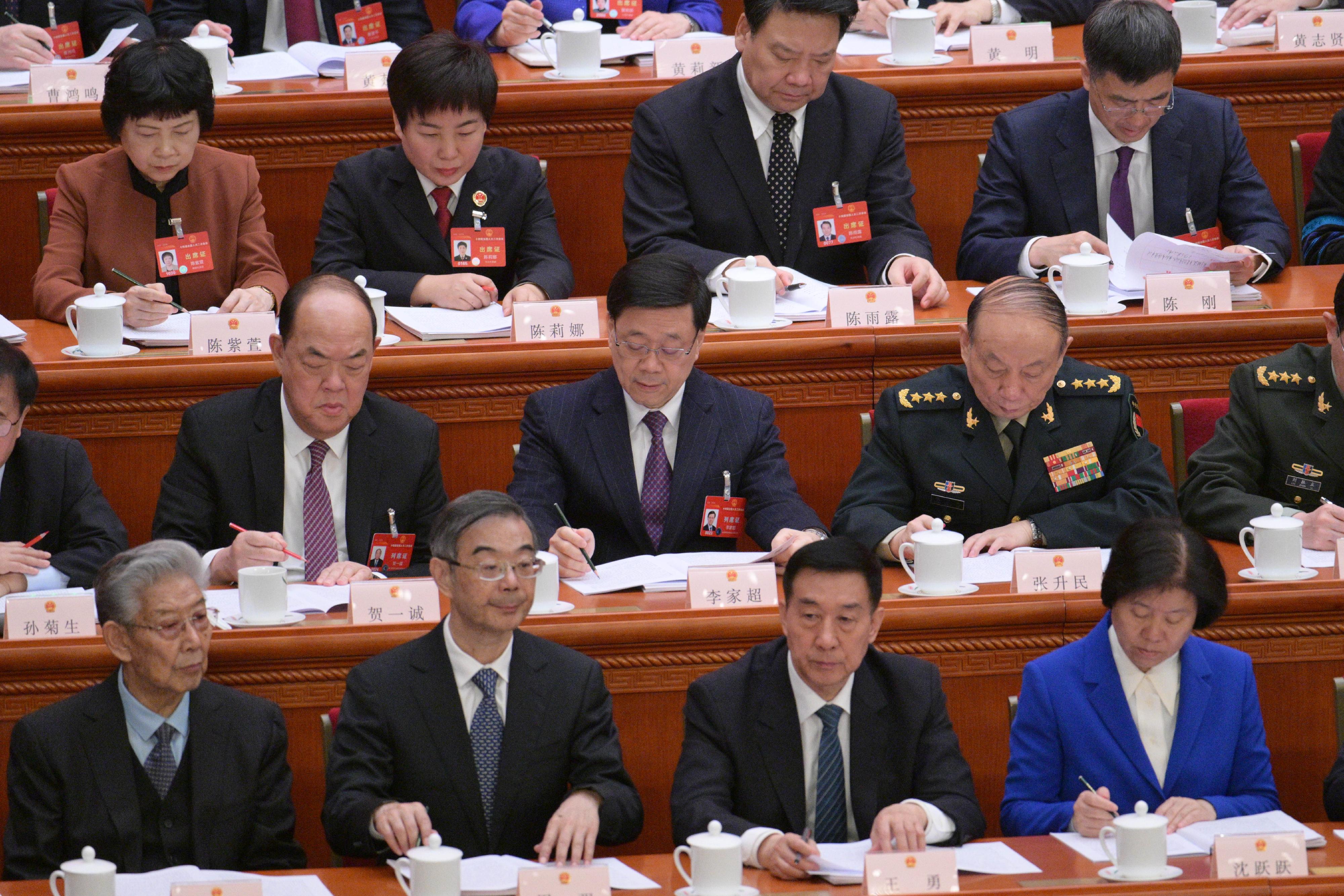 行政長官李家超（第二排中）今日（三月五日）上午在北京列席第十四屆全國人民代表大會第二次會議開幕會。