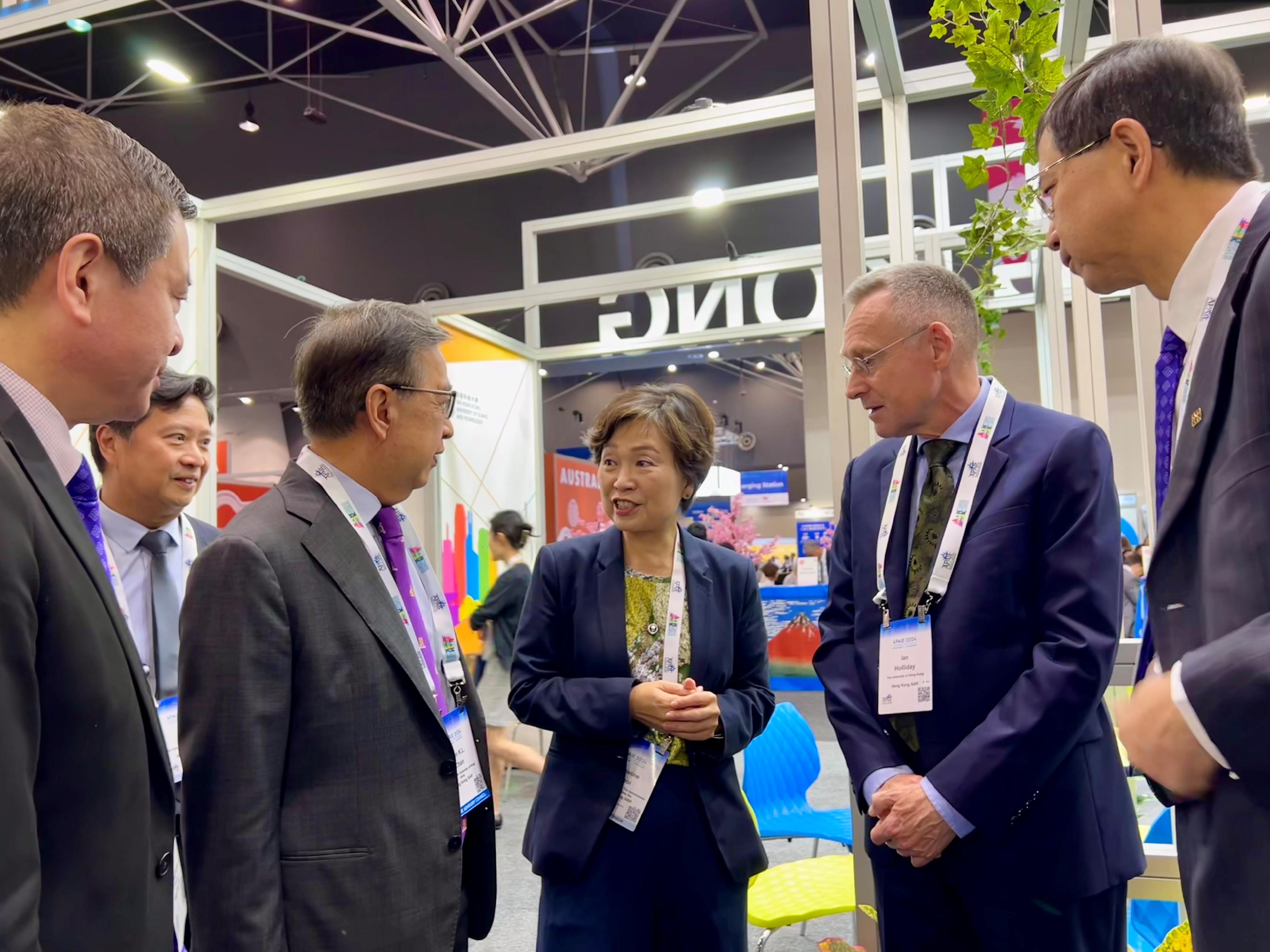 The Secretary for Education, Dr Choi Yuk-lin, visited the Hong Kong Pavilion set up by the Heads of Universities Committee Standing Committee on Internationalisation and funded by the University Grants Committee at the Asia-Pacific Association for International Education 2024 Conference and Exhibition in Perth, Australia, today (March 6, Perth time). Photo shows Dr Choi (third right) chatting with university representatives to learn about their promotion of further studies and exchange programmes in Hong Kong.