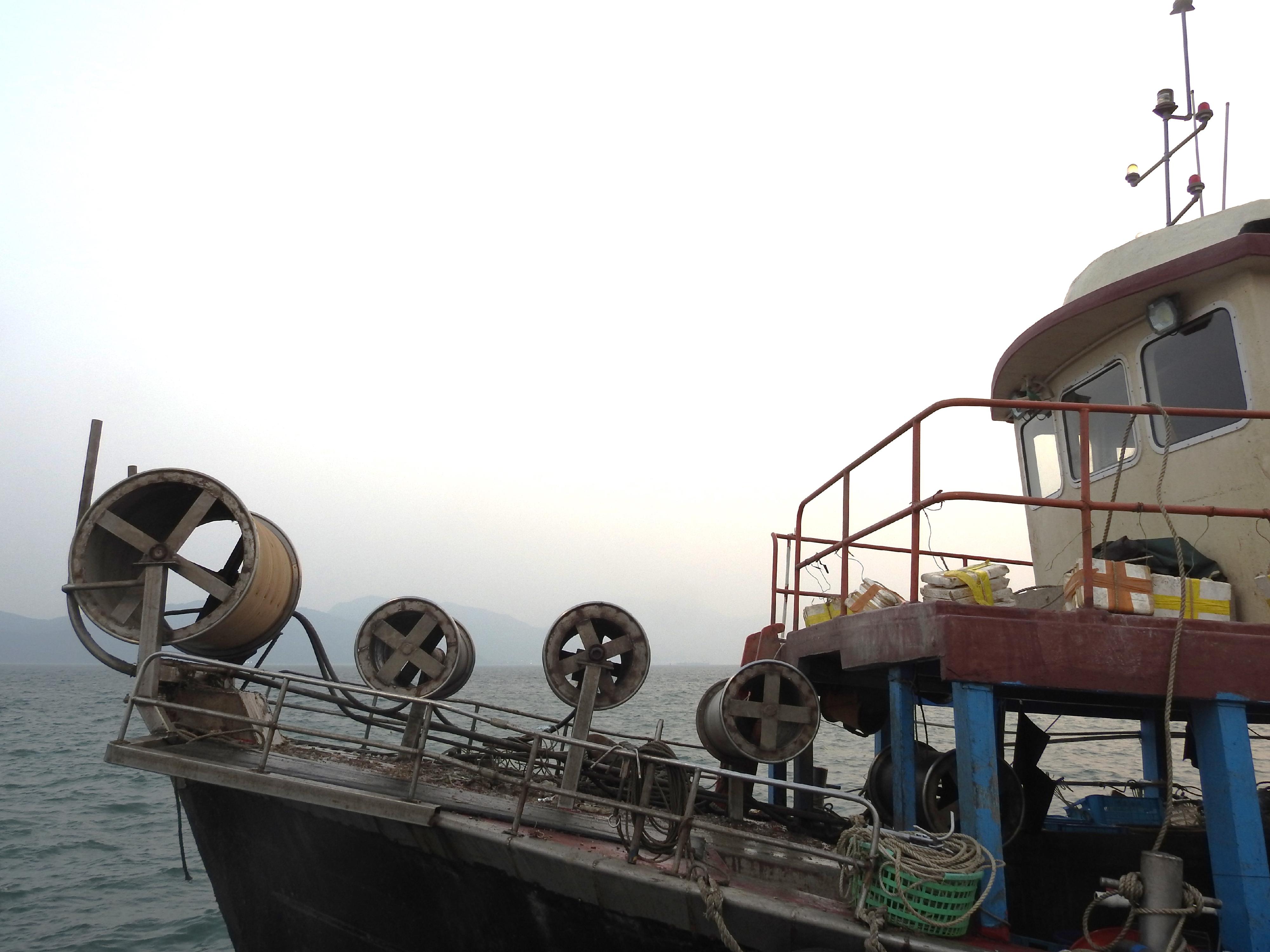 Four Mainland fisherman deckhands engaged in fishing using snake cages (a type of cage trap banned in Hong Kong waters) earlier in waters off the River Trade Terminal in western Hong Kong, and a local coxswain on board were charged for breaching the Fisheries Protection Ordinance (Cap. 171) and convicted today (March 8). Photo shows the seized winches.
