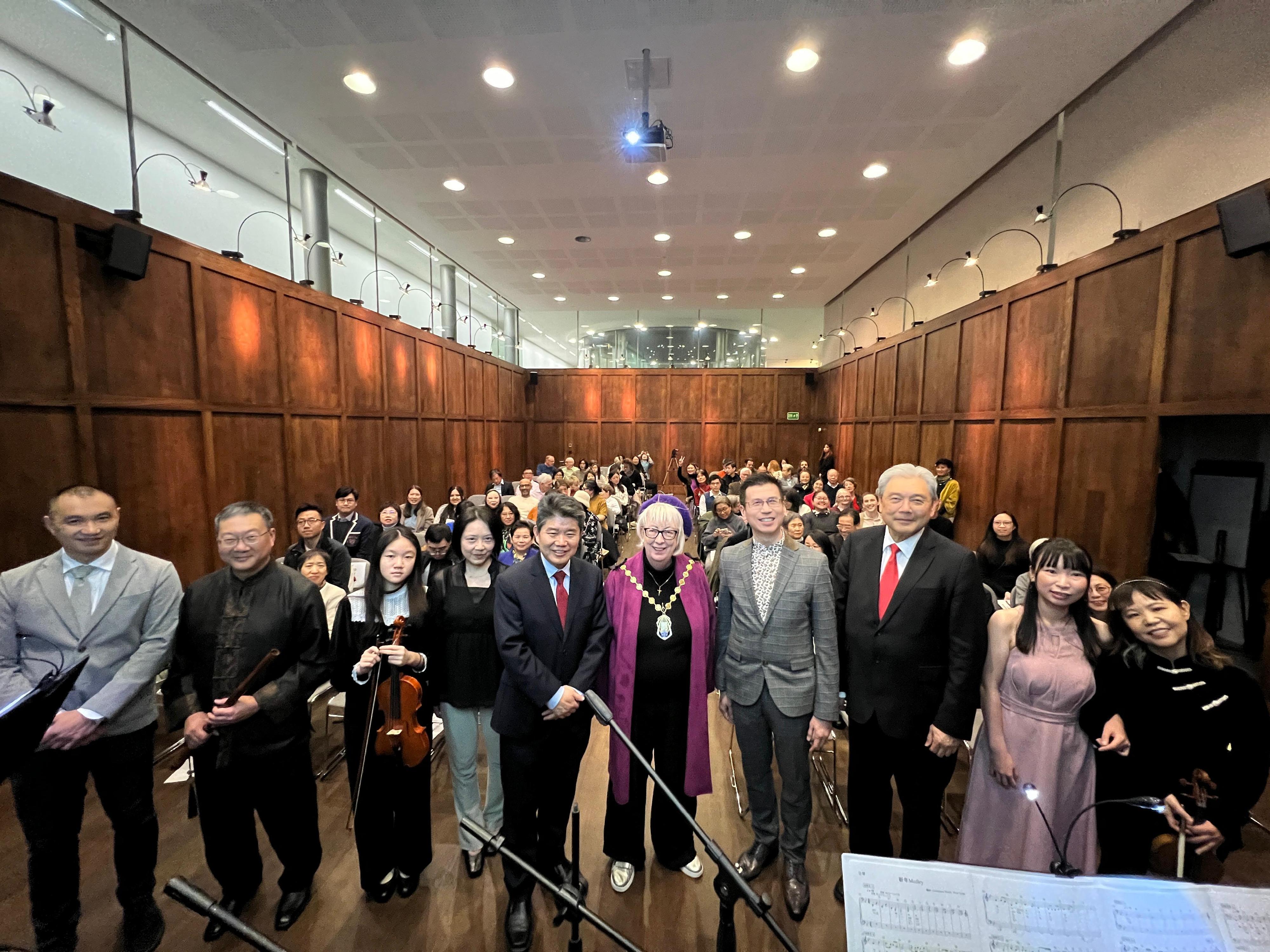 The Hong Kong Economic and Trade Office, London (London ETO) supported the Ming-Ai (London) Institute's Hong Kong pop music concert held at St Martin-in-the-Fields Hall, Trafalgar Square in London, the United Kingdom, on March 7 (London time). Photo shows (from row, from fourth left) the Dean of the Ming-Ai (London) Institute, Ms Li Chungwen; the Minister Counsellor for Cultural Affairs of the Chinese Embassy in the UK, Mr Li Liyan; the Lord Mayor of Westminster, Ms Patricia McAllister; the Director of the London ETO, Mr Gilford Law; the Chairman of the Board of Directors of the Ming-Ai (London) Institute, Professor Jonathan Liu, with the performers and audience members at the concert.