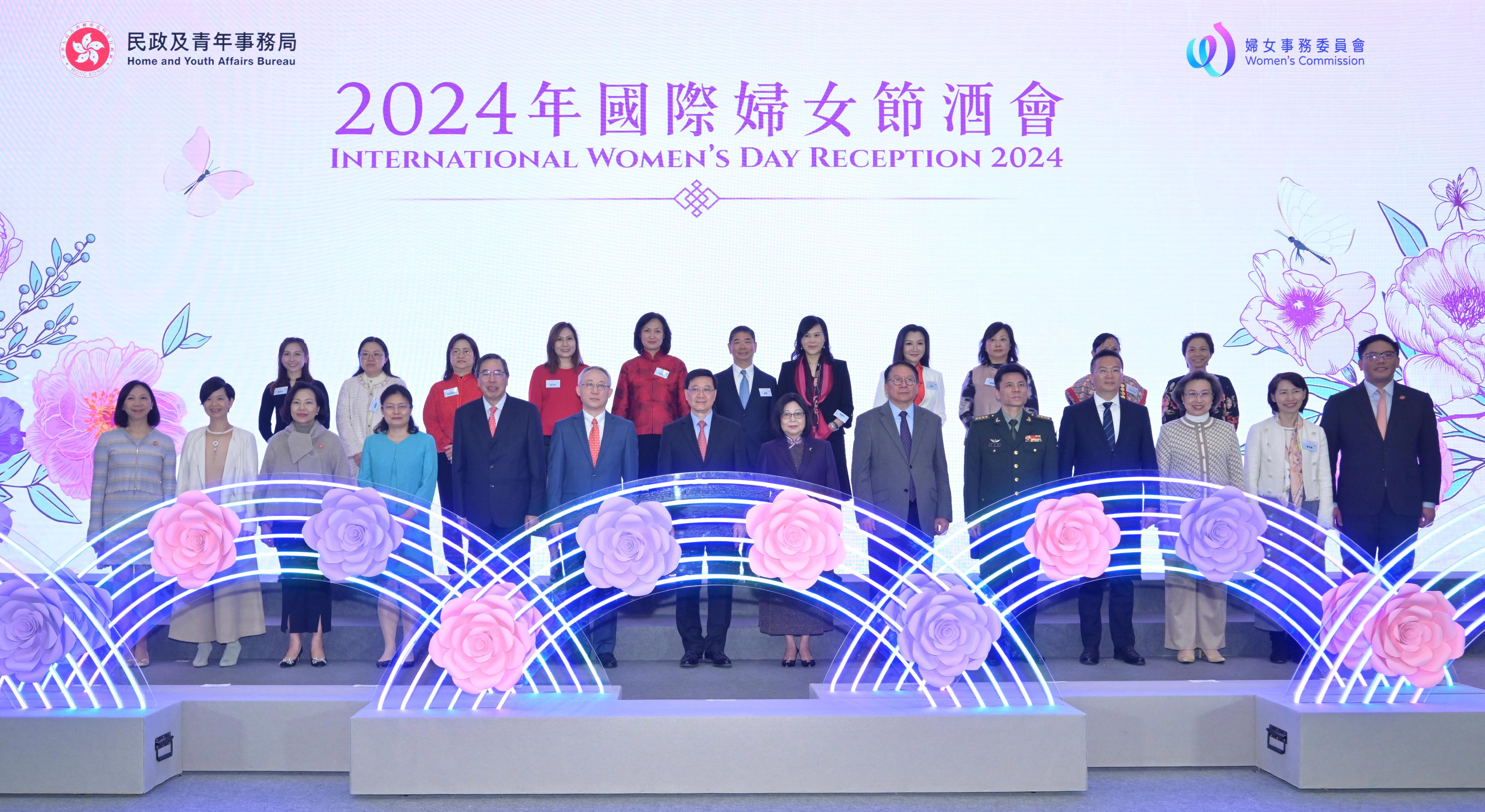 The Chief Executive, Mr John Lee, attended the International Women's Day Reception 2024 today (March 8). Photo shows (first row, from left) the Permanent Secretary for Home and Youth Affairs, Ms Shirley Lam; the Secretary for Housing, Ms Winnie Ho; the Secretary for Home and Youth Affairs, Miss Alice Mak; Deputy Director-General of the Coordination Department of the Liaison Office of the Central People's Government in the Hong Kong Special Administrative Region (HKSAR) Ms Li Ling; the President of the Legislative Council, Mr Andrew Leung; the Acting Commissioner of the Office of the Commissioner of the Ministry of Foreign Affairs of the People's Republic of China in the HKSAR, Mr Li Yongsheng; Mr Lee and his wife; the Chief Secretary for Administration, Mr Chan Kwok-ki; Deputy Director of the Political Department of the Chinese People's Liberation Army Hong Kong Garrison Senior Colonel Qi Xiaochun; Deputy Director of the liaison office of the Office for Safeguarding National Security of the Central People's Government in the HKSAR Mr Xie Zhixiang; the Secretary for the Civil Service, Mrs Ingrid Yeung; the Director of the Chief Executive's Office, Ms Carol Yip; and the Under Secretary for Home and Youth Affairs, Mr Clarence Leung, with members of the Women's Commission at the reception.
