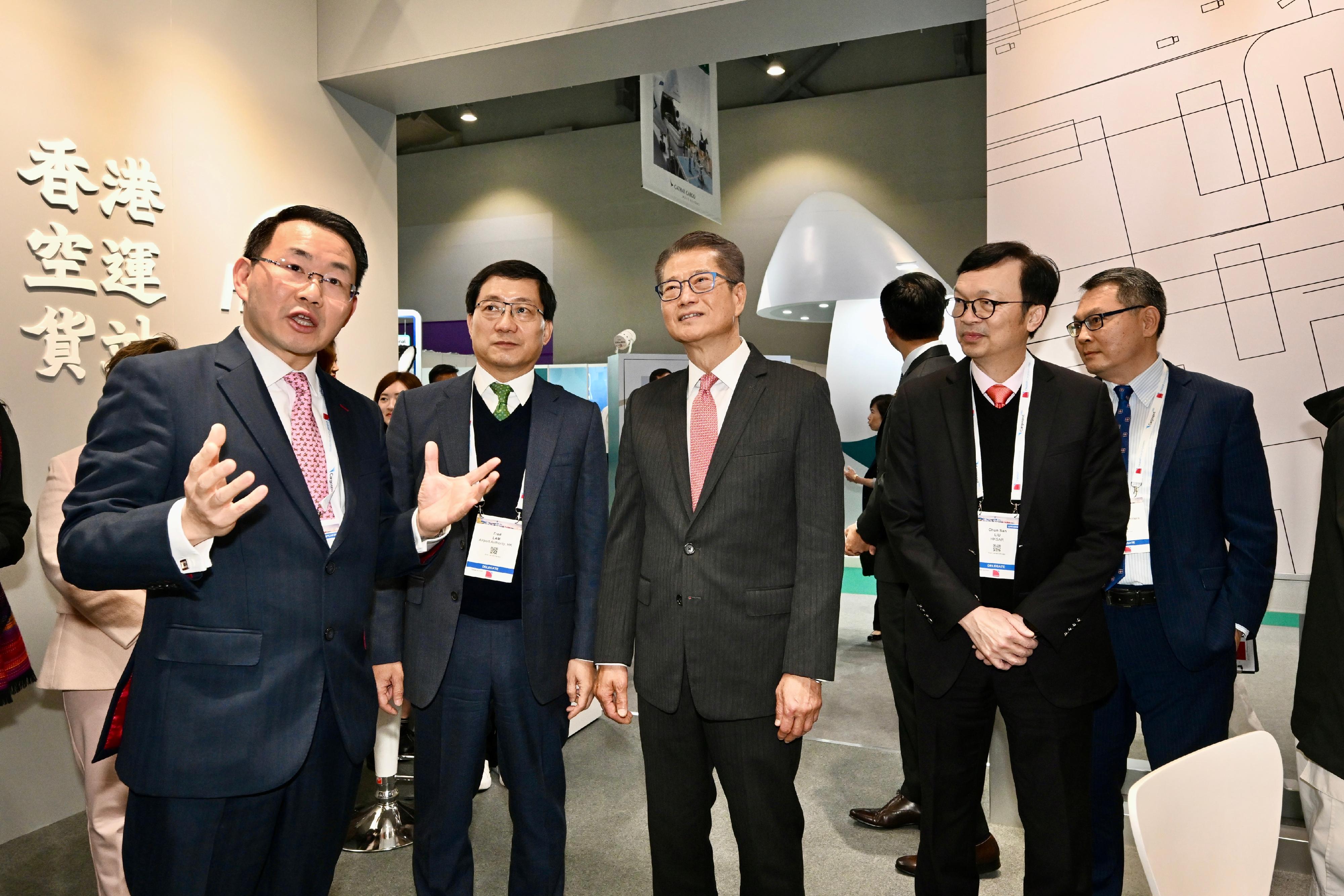 The Financial Secretary, Mr Paul Chan, attended the International Air Transport Association (IATA) World Cargo Symposium today (March 12). Photo shows Mr Chan (centre) touring the exhibition.

