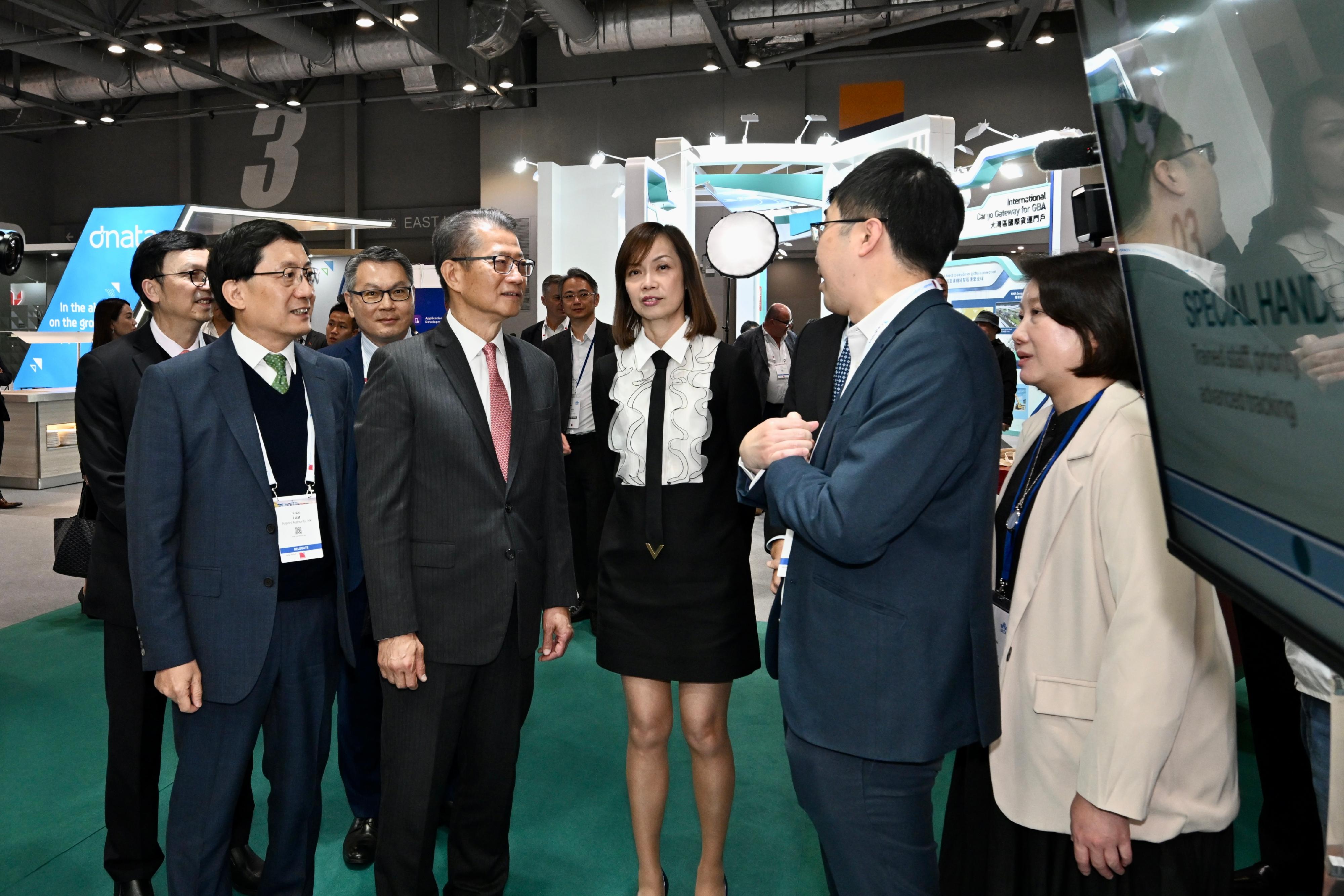 The Financial Secretary, Mr Paul Chan, attended the International Air Transport Association (IATA) World Cargo Symposium today (March 12). Photo shows Mr Chan (front row, second left) touring the exhibition.

