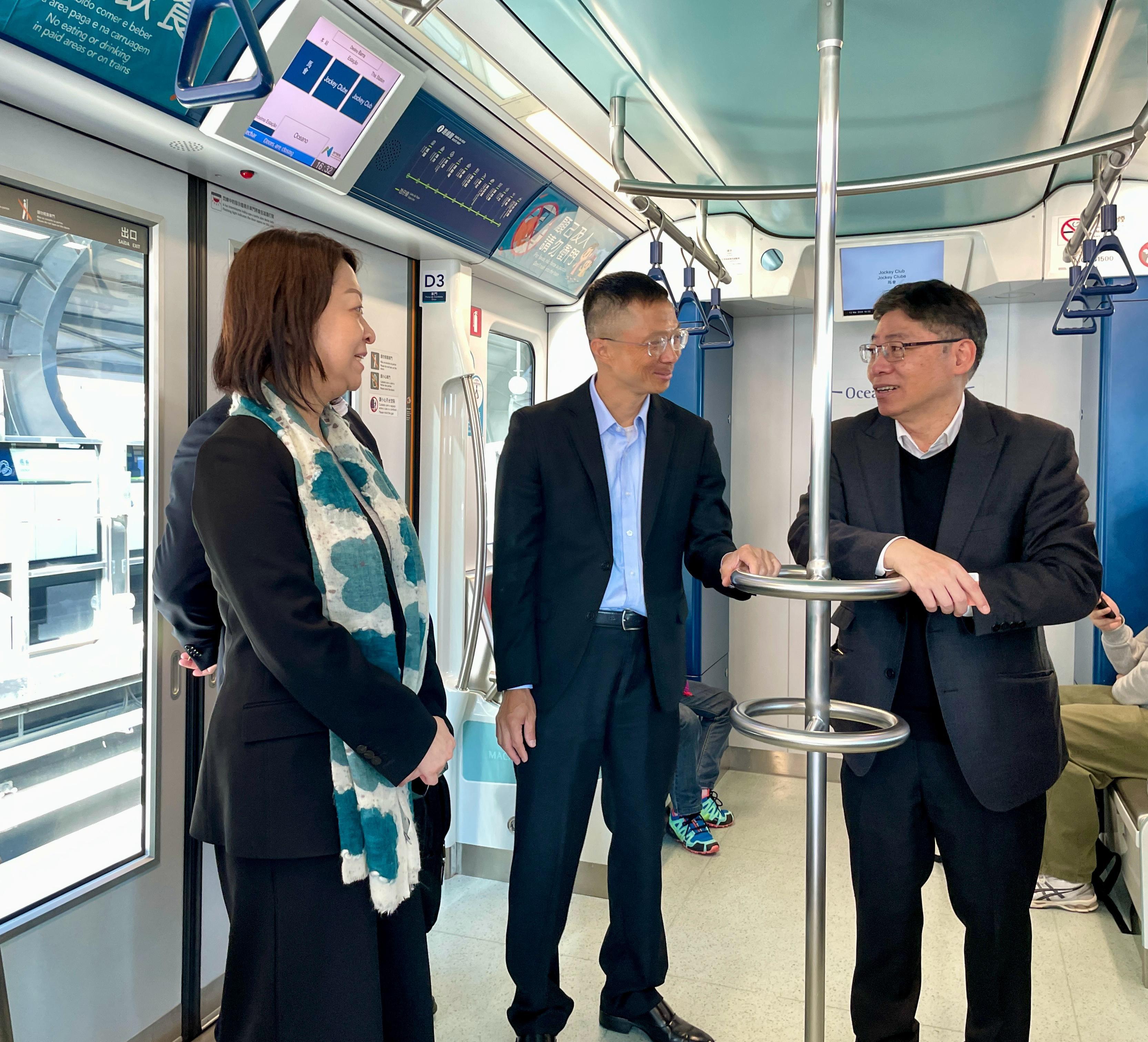 The Secretary for Transport and Logistics, Mr Lam Sai-hung, visited Zhuhai and Macao today (March 12). Photo shows Mr Lam (right), accompanied by the Director of the Macao Transport Bureau, Mr Lam Hin-san (centre), inspecting the Macao Light Rapid Transit. Also present is the Commissioner for Transport, Ms Angela Lee (left).