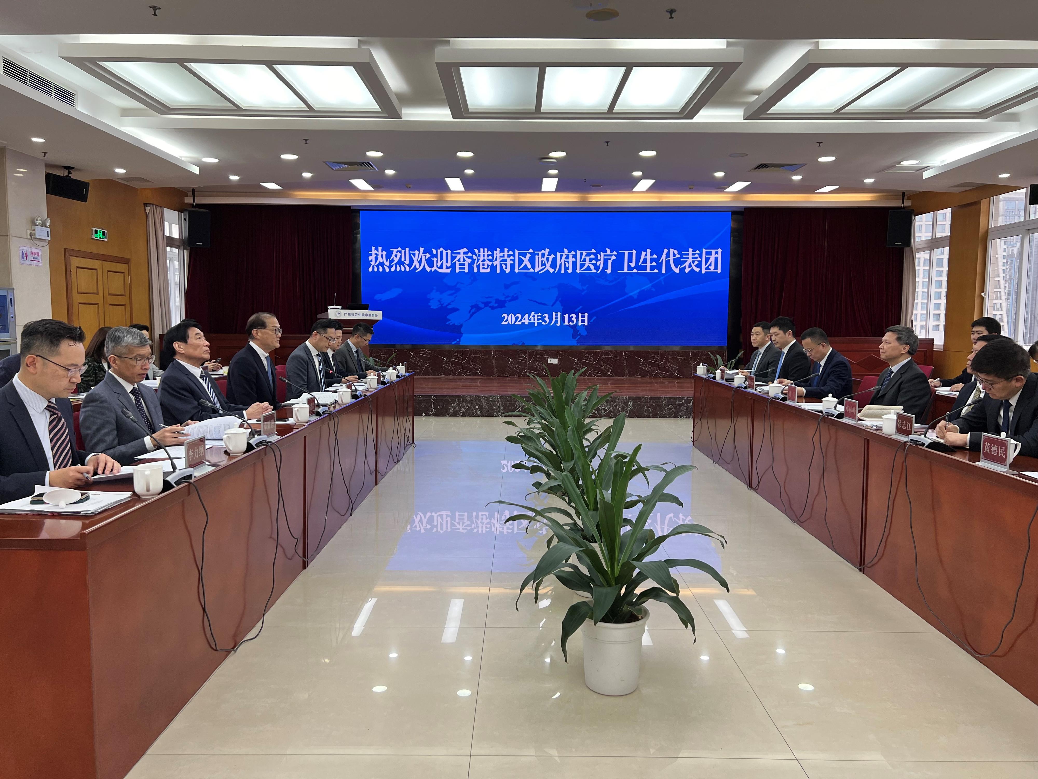 ​The Secretary for Health, Professor Lo Chung-mau (fourth left), and his delegation meet Deputy Director General of the Health Commission of Guangdong Province Mr Huang Fei (third right) in Guangzhou today (March 13) to discuss a number of cross-boundary healthcare services, with the Director of Health, Dr Ronald Lam (fifth left); the Controller of the Centre for Health Protection of the Department of Health, Dr Edwin Tsui (sixth left); Deputy Secretary for Health Mr Eddie Lee (first left); the Senior Advisor (Secretary for Health's Office), Dr Joe Fan (seventh left); the Chairman of the Hospital Authority (HA), Mr Henry Fan (third left); and the Deputising Chief Executive of the HA, Dr Simon Tang (second left), in attendance.