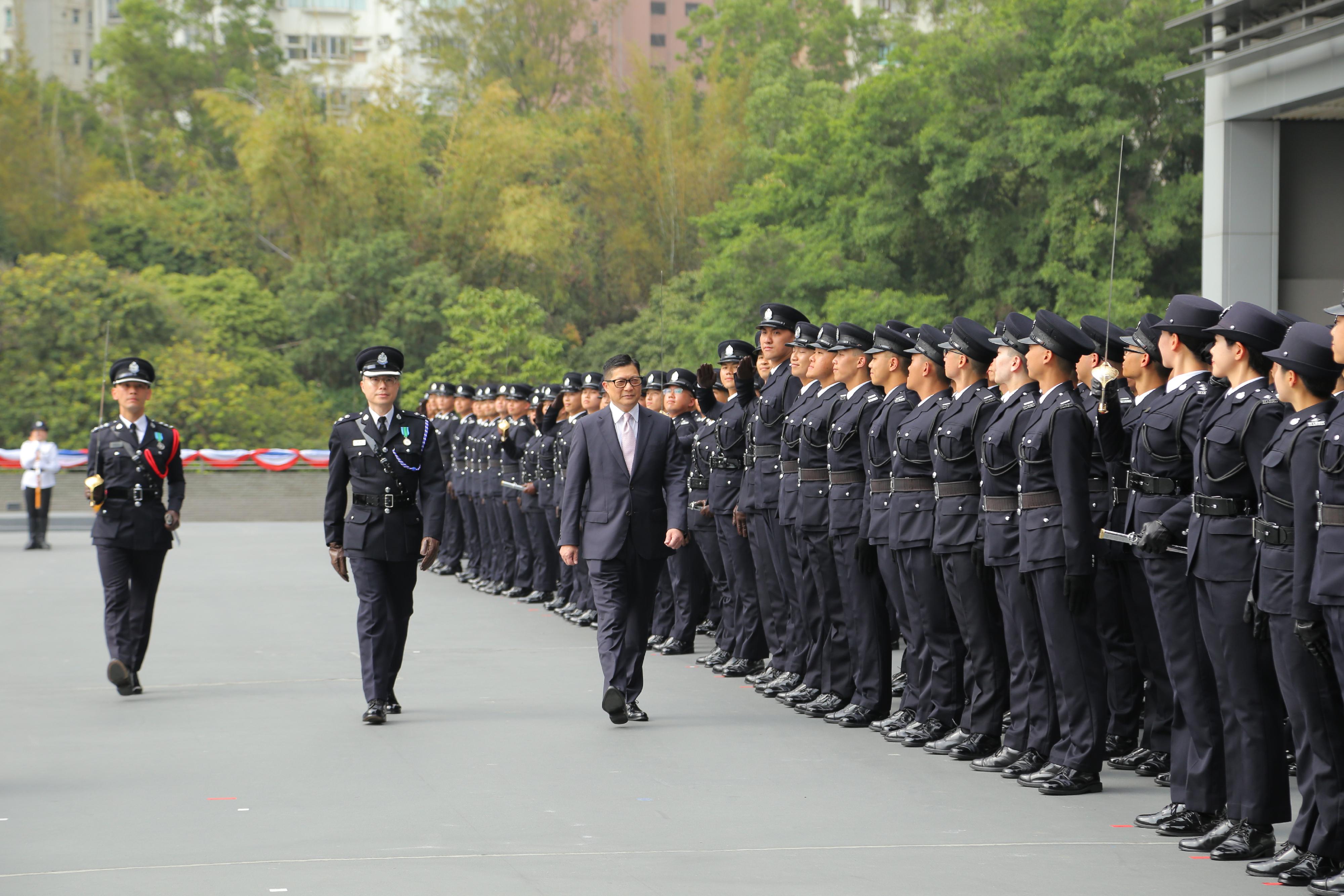 The Secretary for Security, Mr Tang Ping-keung, inspects a contingent of graduates at the Immigration Service Institute of Training and Development Passing-out Parade today (March 15).
