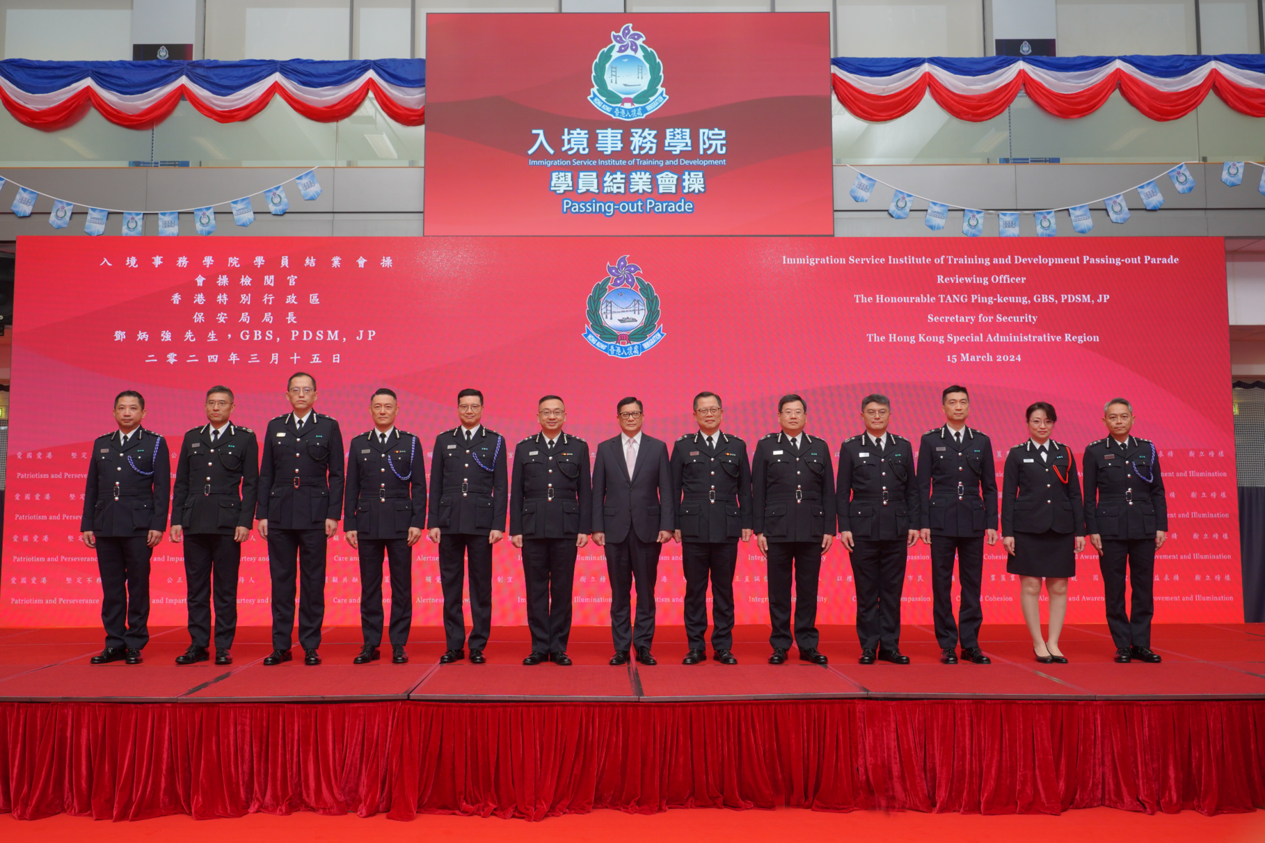 The Immigration Service Institute of Training and Development Passing-out Parade was held today (March 15). Photo shows the Secretary for Security, Mr Tang Ping-keung (seventh right), with directorate officers of the Immigration Department after the parade.