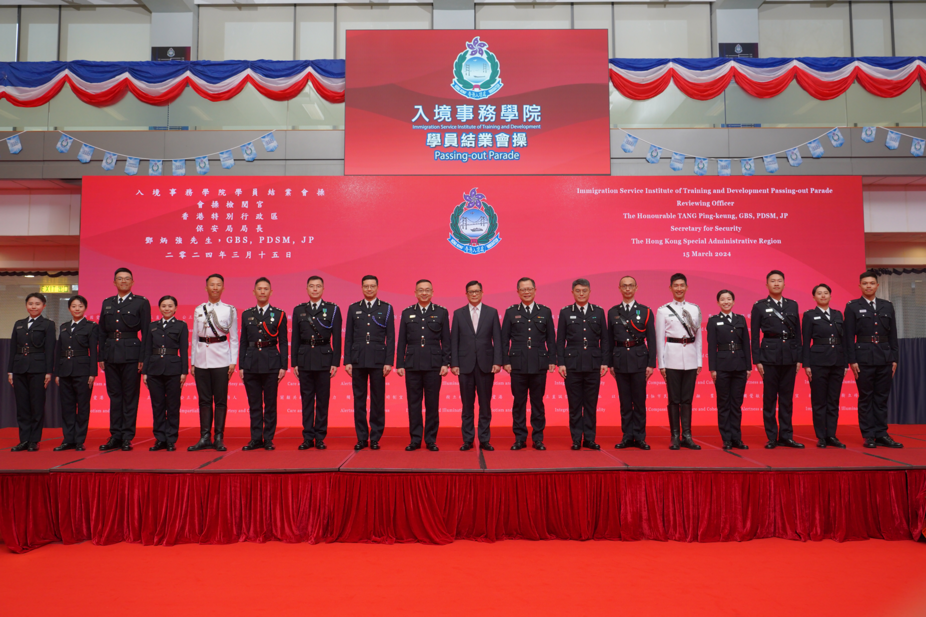 The Secretary for Security, Mr Tang Ping-keung (ninth right), is pictured with graduates awarded the "Best Recruit Shields" after the Immigration Service Institute of Training and Development Passing-out Parade today (March 15).