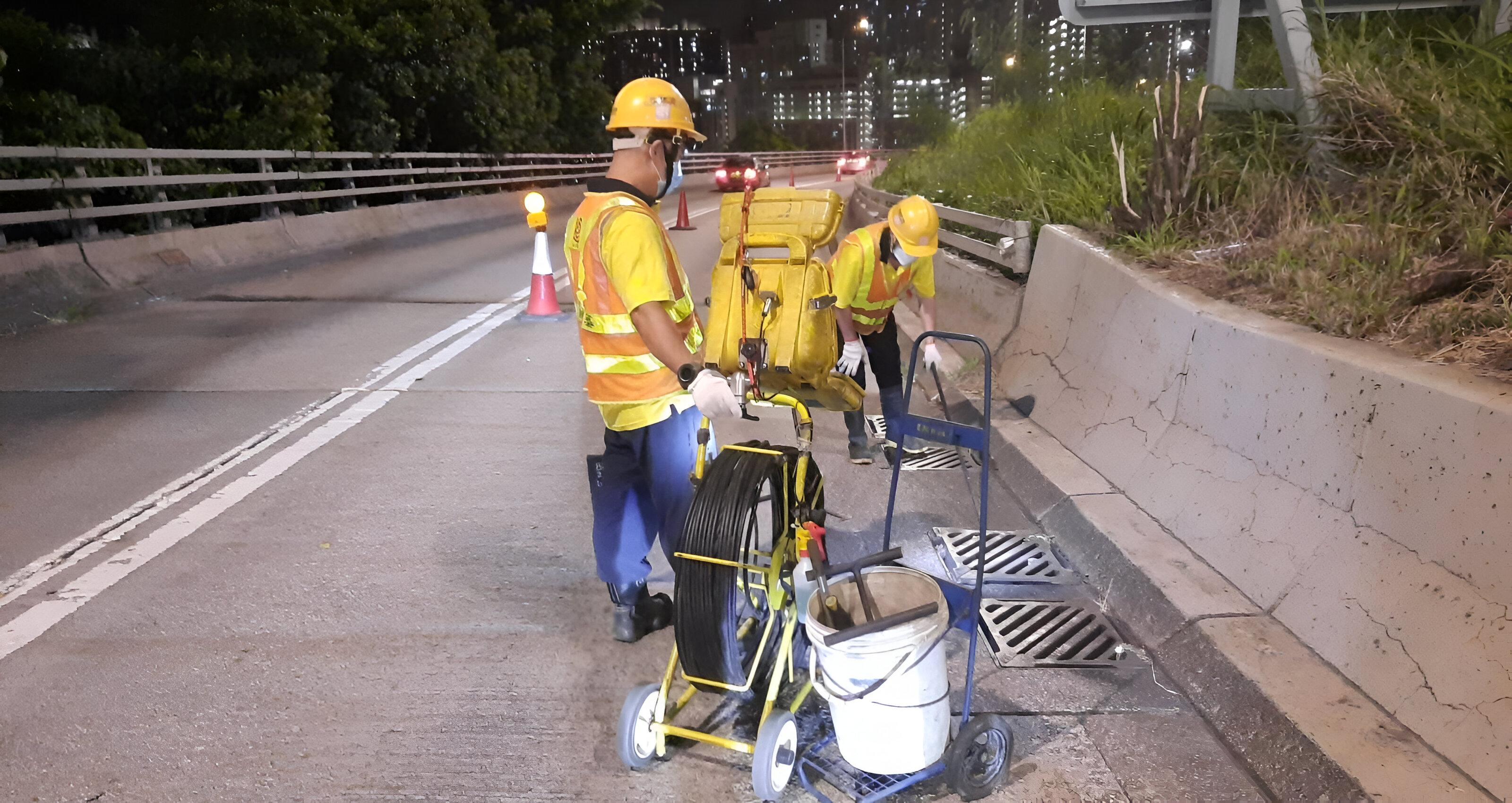 The Emergency Control Centres of the Highways Department today (March 17) conducted a drill to enhance the capability to cope with inclement weather. Photo shows staff members of a contractor inspecting a gully by closed-circuit television before the drill to ensure the drain is free from blockage.