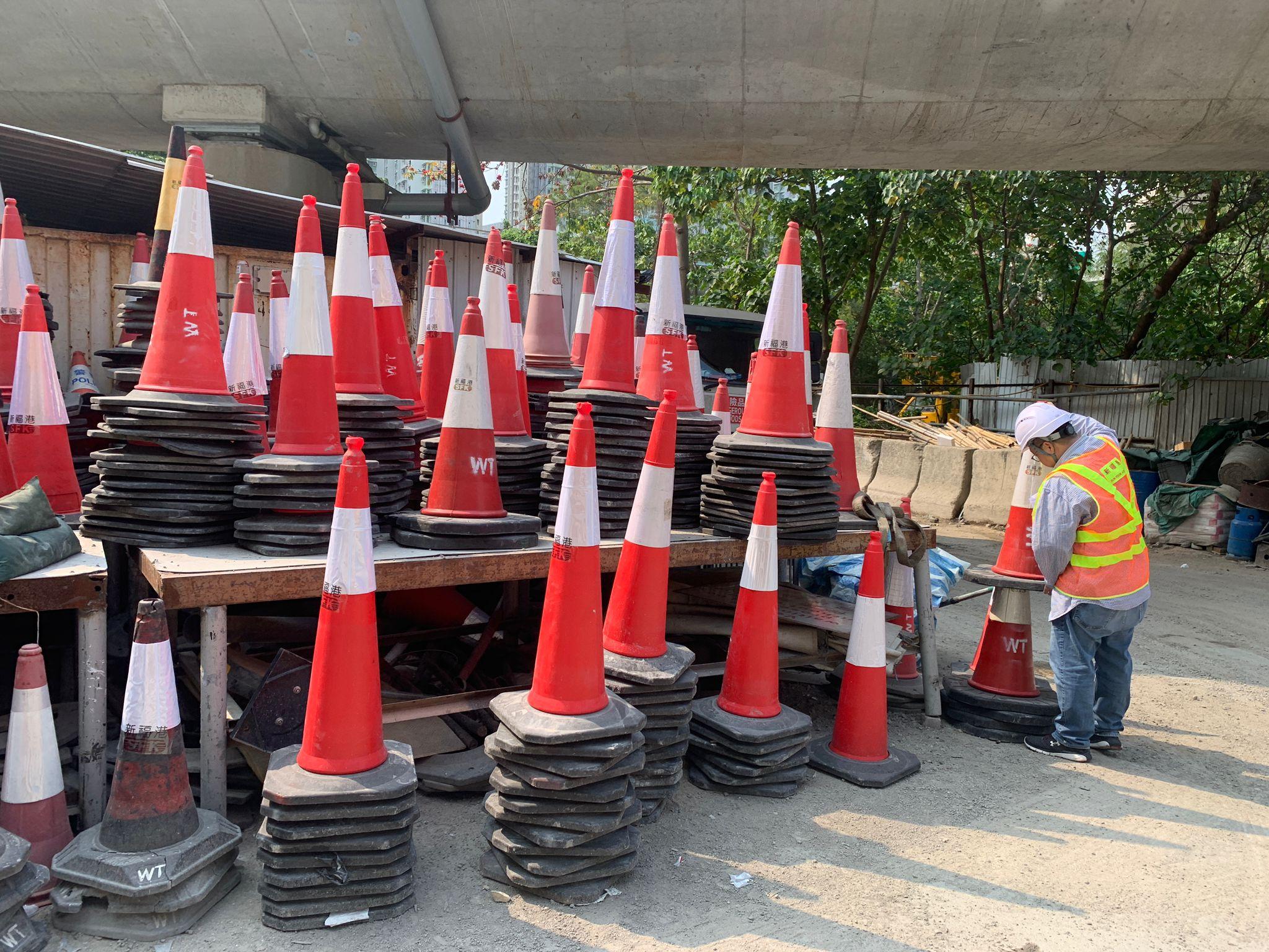 The Emergency Control Centres of the Highways Department today (March 17) conducted a drill to enhance the capability to cope with inclement weather. Photo shows a staff member of a contractor inspecting and stocktaking traffic cones to be used for temporary road closures before the drill.