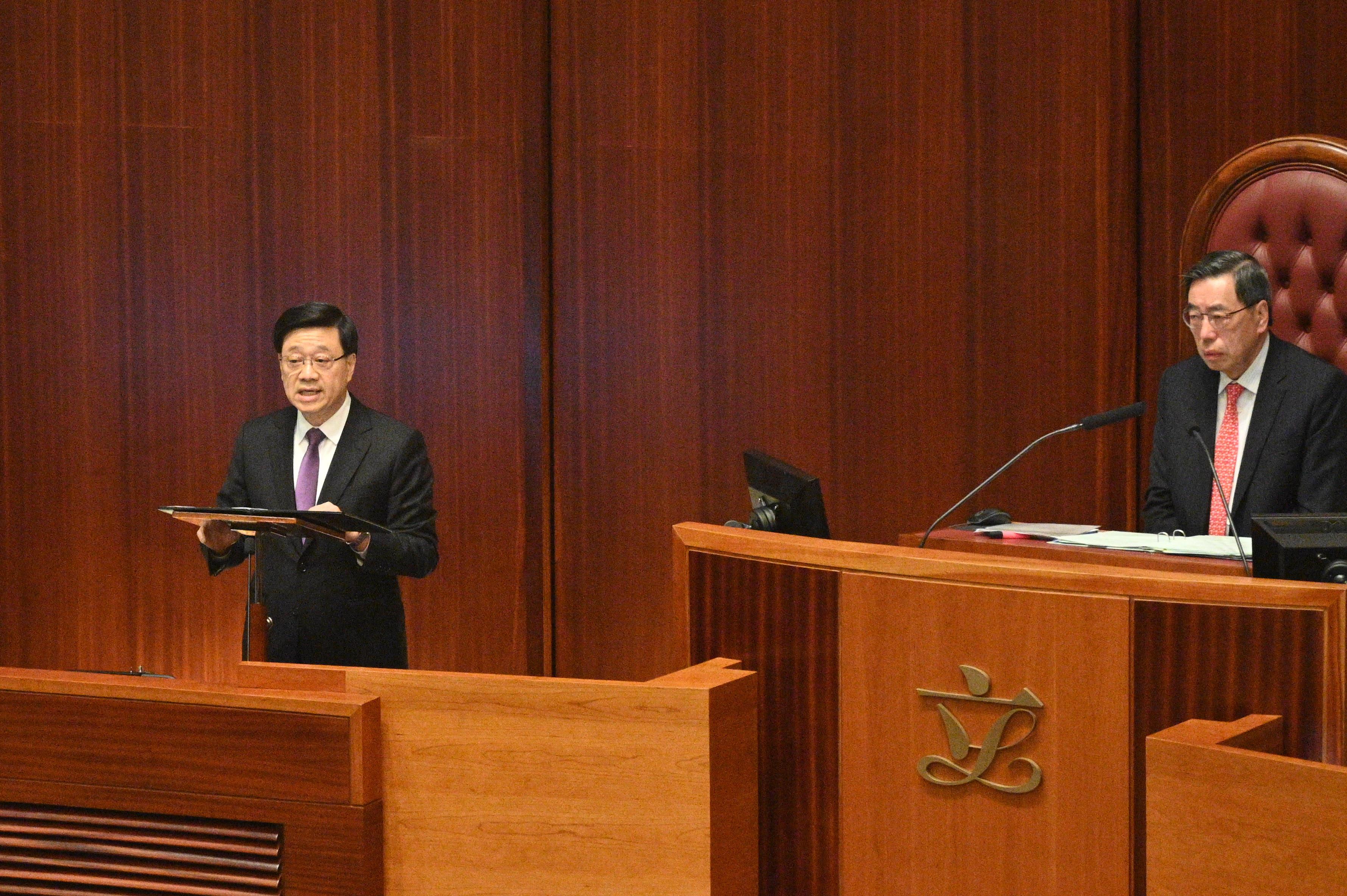 The Chief Executive, Mr John Lee (left), addresses at the Legislative Council (LegCo) meeting on the LegCo's passage of the Safeguarding National Security Bill today (March 19).