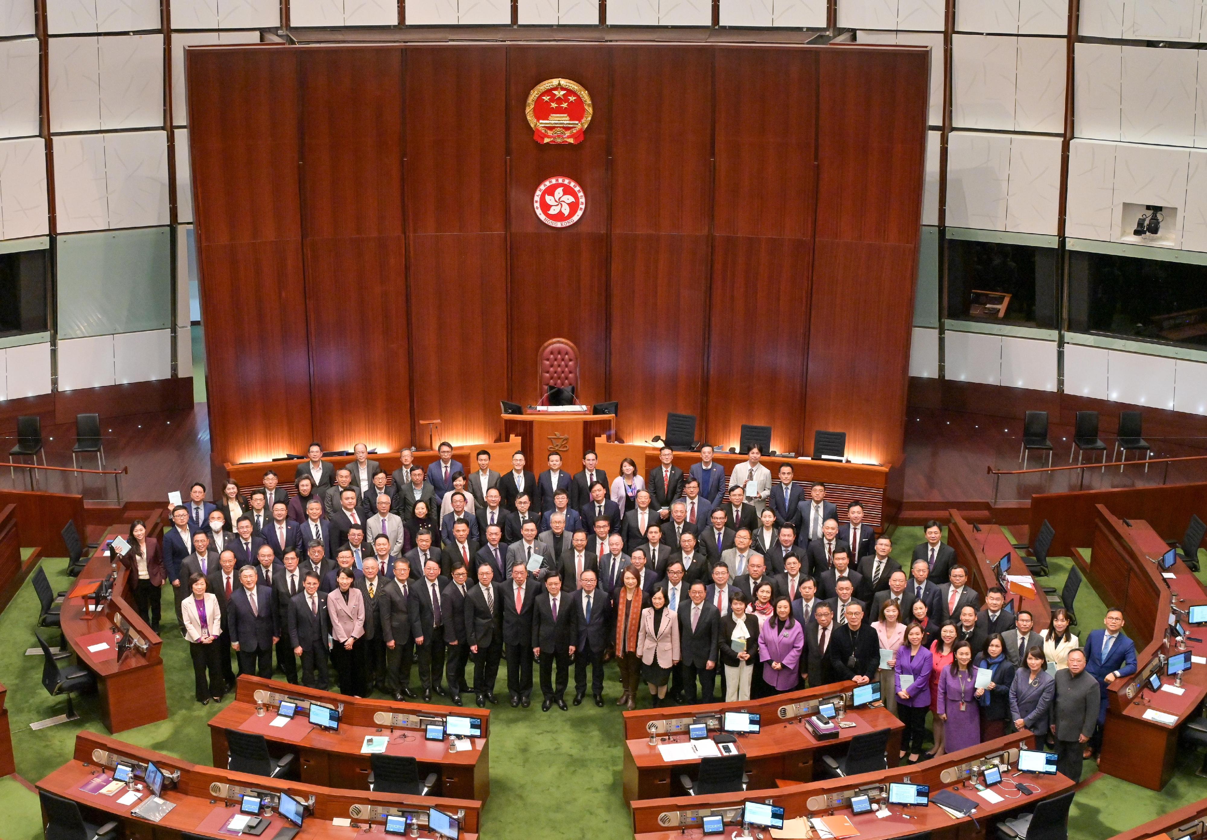 The Chief Executive, Mr John Lee, addresses at the Legislative Council (LegCo) meeting on the LegCo's passage of the Safeguarding National Security Bill today (March 19). Photo shows Mr Lee (first row, ninth left) with Chief Secretary for Administration, Mr Chan Kwok-ki (first row, fifth left); the Financial Secretary, Mr Paul Chan (first row, fourth left); the Secretary for Justice, Mr Paul Lam, SC (first row, seventh left); and the Secretary for Security, Mr Tang Ping-keung (first row, sixth left); the President of the Legislative Council, Mr Andrew Leung (first row, eighth left) and Members of the LegCo at the Chamber after addressing to LegCo.