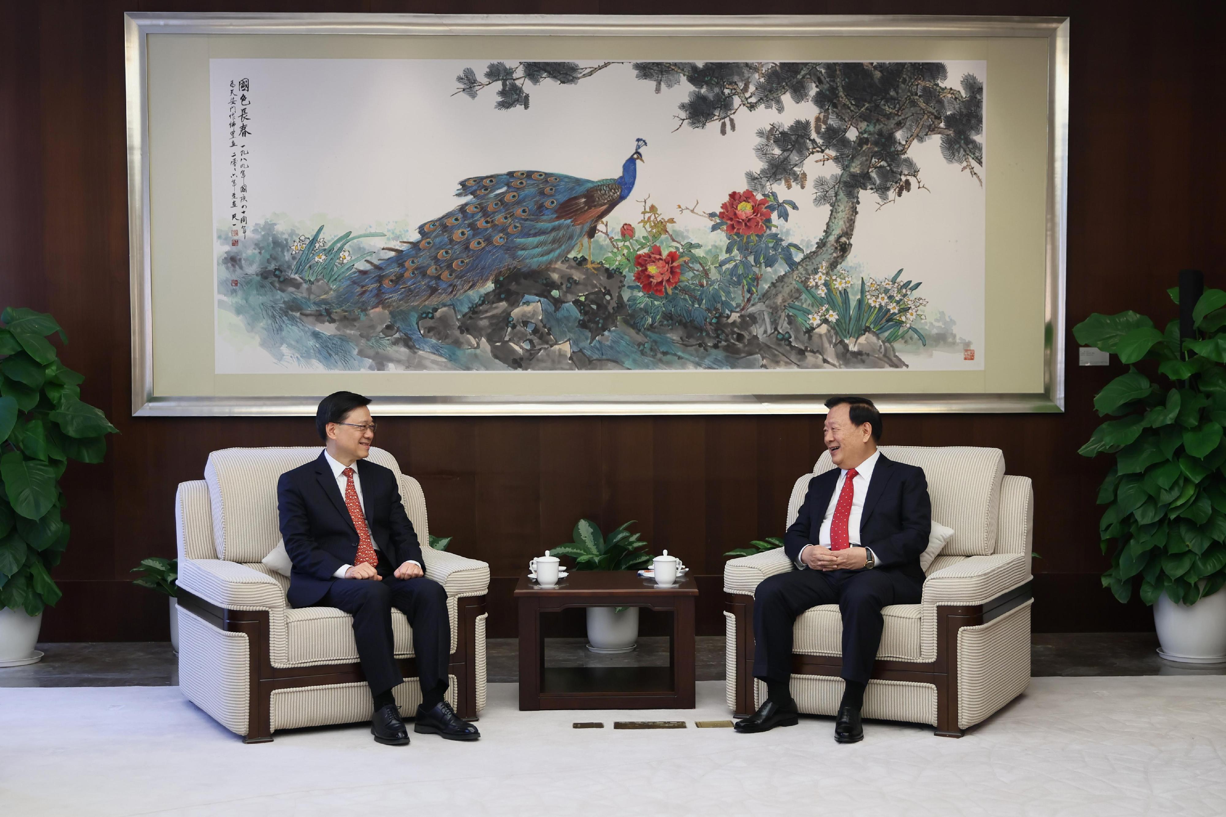 The Director of the Hong Kong and Macao Work Office of the Communist Party of China Central Committee and the Hong Kong and Macao Affairs Office of the State Council, Mr Xia Baolong (right), meets the Chief Executive, Mr John Lee (left), in Shenzhen this morning (March 21).