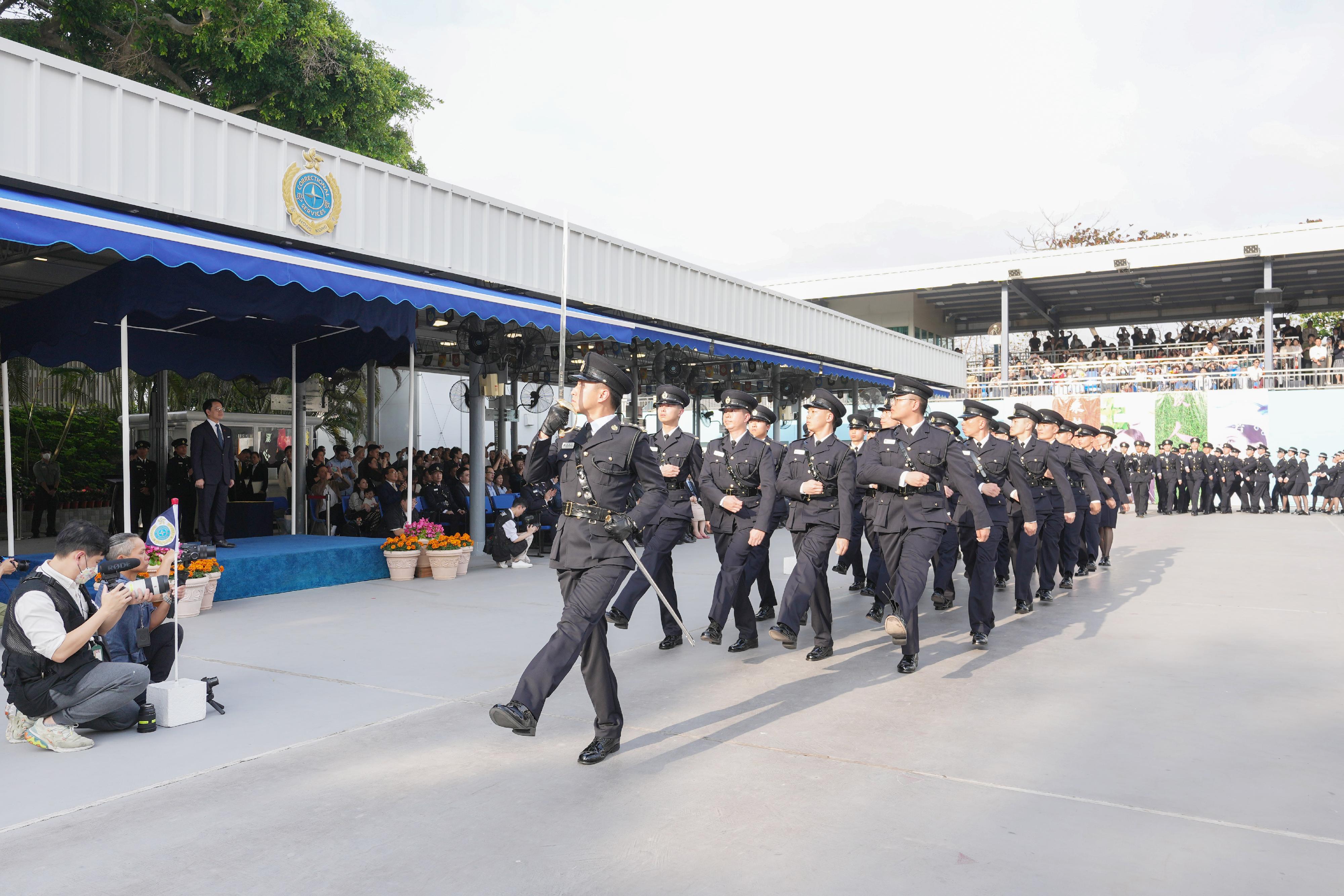 The Correctional Services Department held a passing-out parade at the Hong Kong Correctional Services Academy today (March 22). Photo shows the parade marching past the dais.