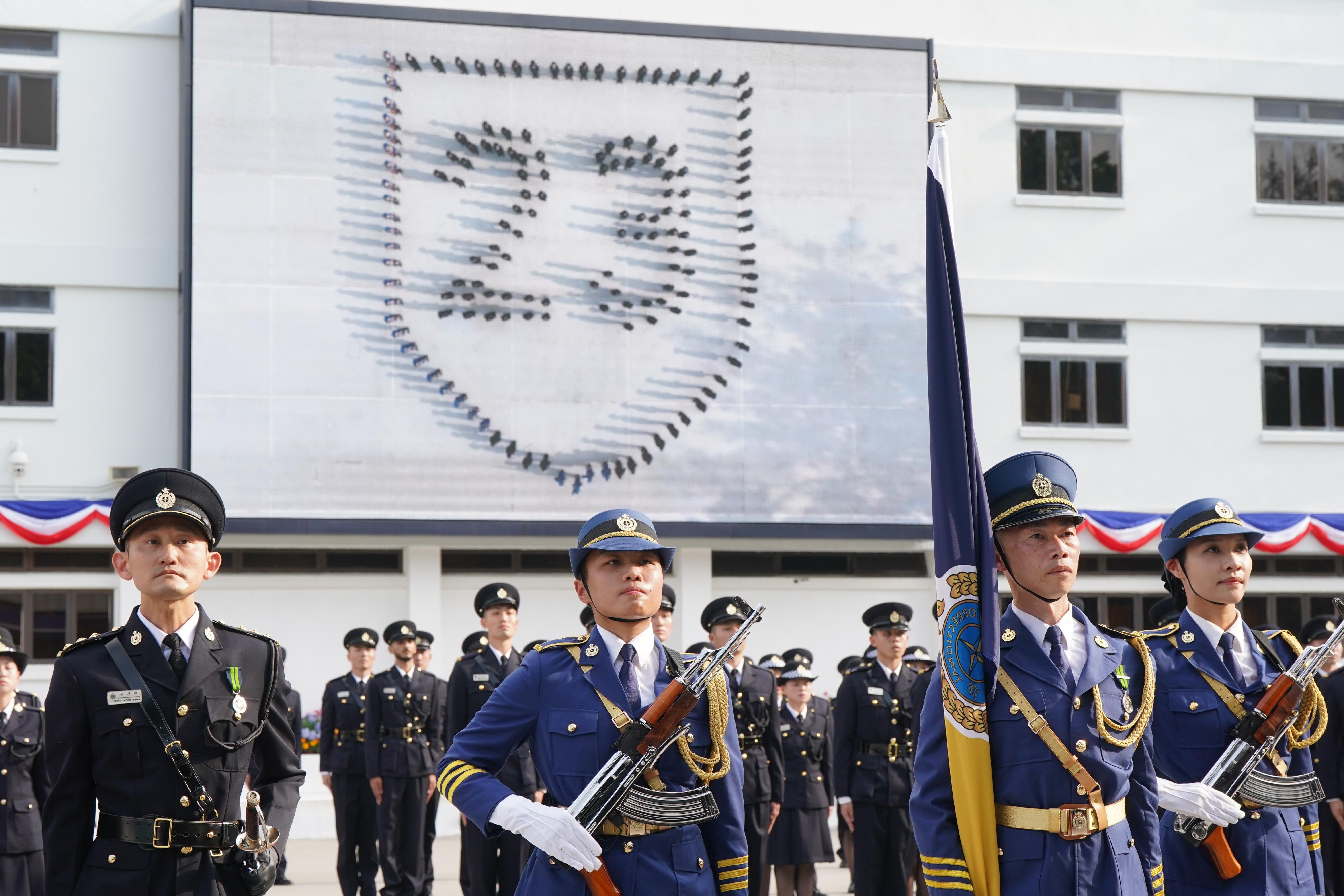 The Correctional Services Department held a passing-out parade at the Hong Kong Correctional Services Academy today (March 22). Photo shows passing-out correctional officers assembling to form a shield pattern incorporated with the number "23", symbolising that the Safeguarding National Security Ordinance can safeguard the country and protect Hong Kong like a shield.