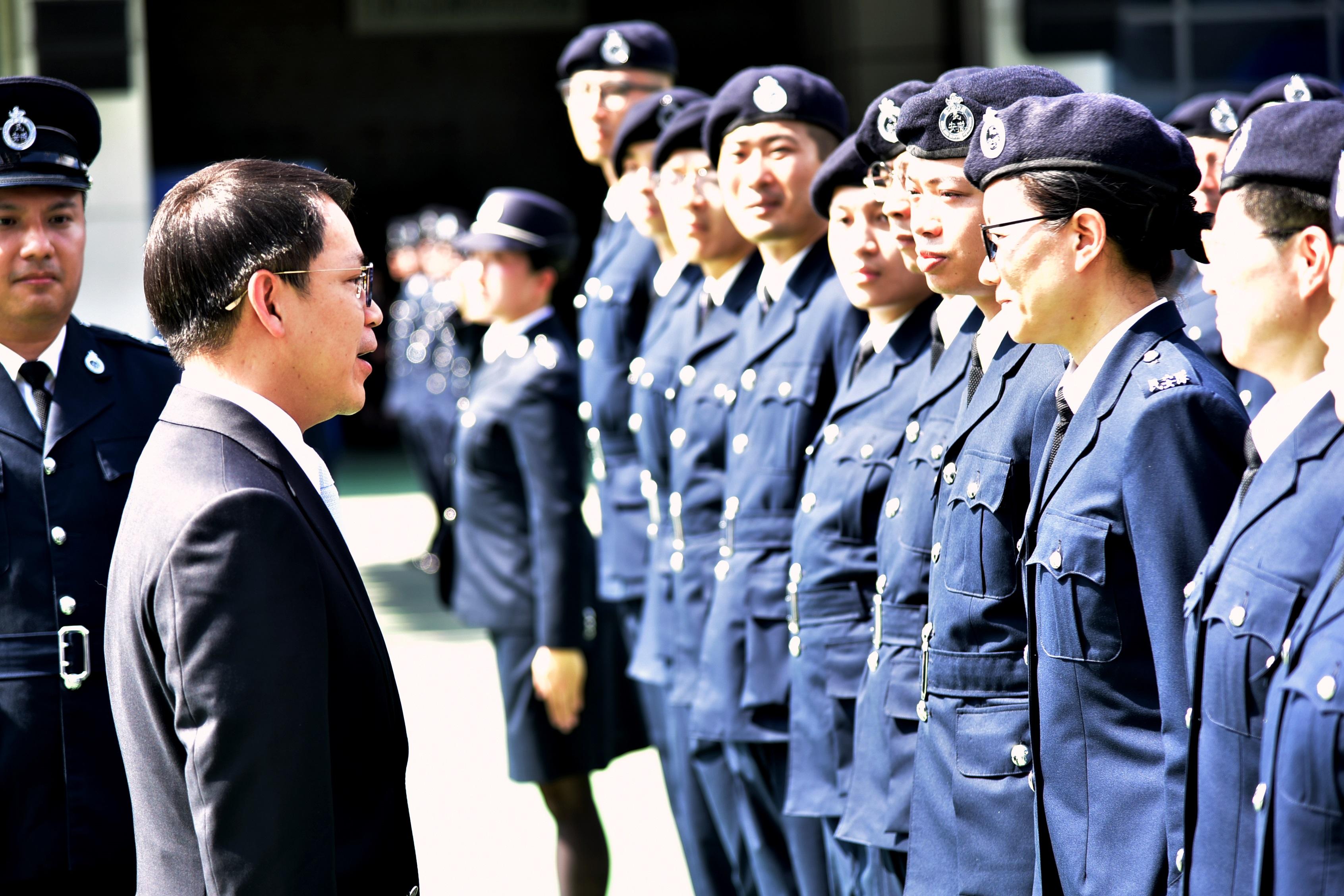 The Civil Aid Service held the 87th Recruits Passing-out Parade at its headquarters today (March 24). Photo shows Non-official Member of the Executive Council and Legislative Council Member Mr Chan Hak-kan (left) inspecting the parade.