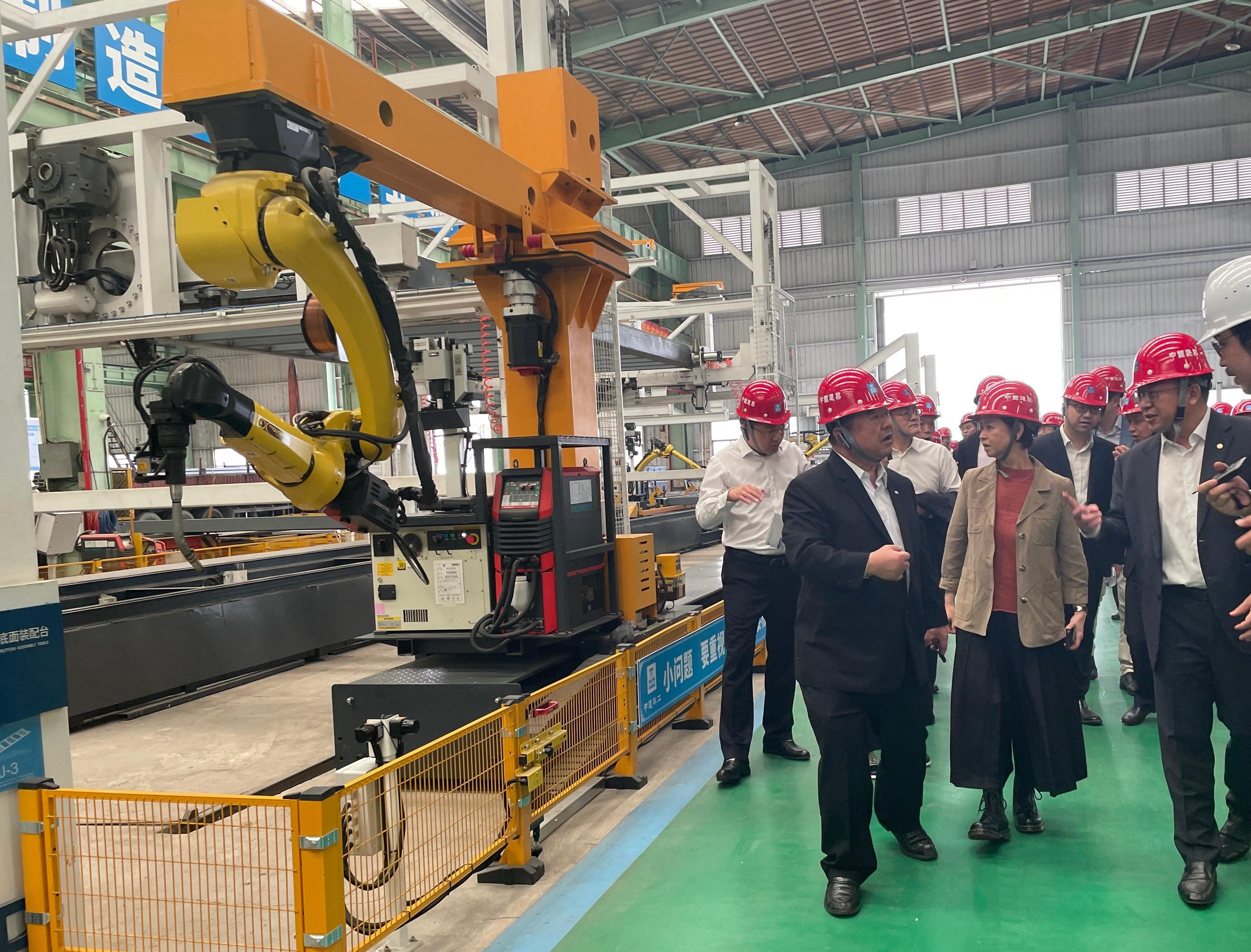 The Secretary for Housing, Ms Winnie Ho, and a delegation of representatives from the Housing Bureau and the Architectural Services Department visited Huizhou today (March 25) to inspect the production progress of Modular Integrated Construction (MiC) modules of Light Public Housing (LPH). Photo shows Ms Ho (front row, centre) visiting CSCEC Science and Industry Greentech Corporation Limited to inspect the factory manufacturing LPH MiC modules.