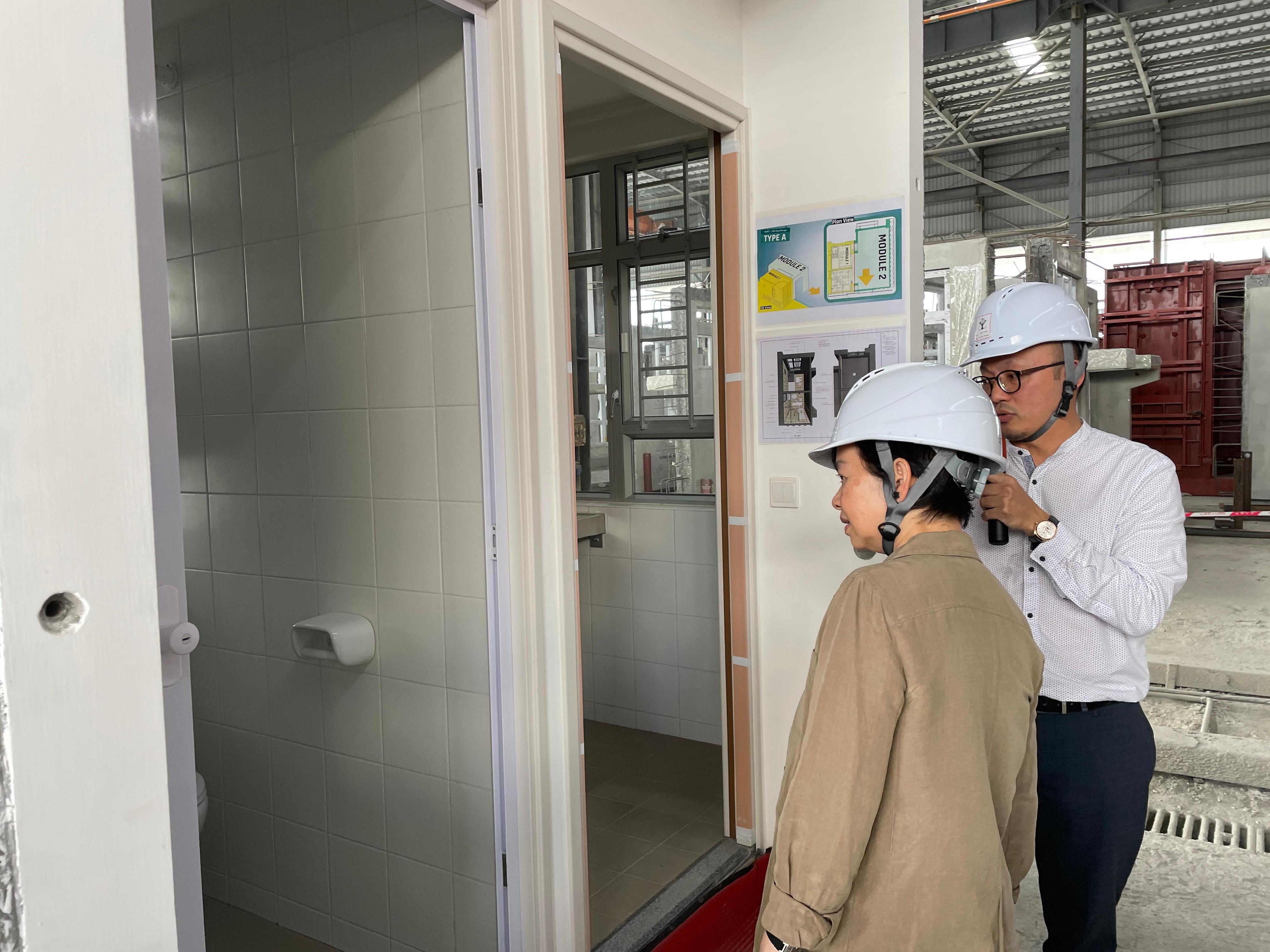 The Secretary for Housing, Ms Winnie Ho, and a delegation of representatives from the Housing Bureau and the Architectural Services Department visited Huizhou today (March 25) to inspect the production progress of Modular Integrated Construction (MiC) modules of Light Public Housing. Photo shows Ms Ho (left) visiting the factory of a Hong Kong enterprise, Yau Lee Wah Construction Materials (Huizhou) Company Limited, in the afternoon to inspect MiC modules for public housing projects of the Hong Kong Housing Authority.