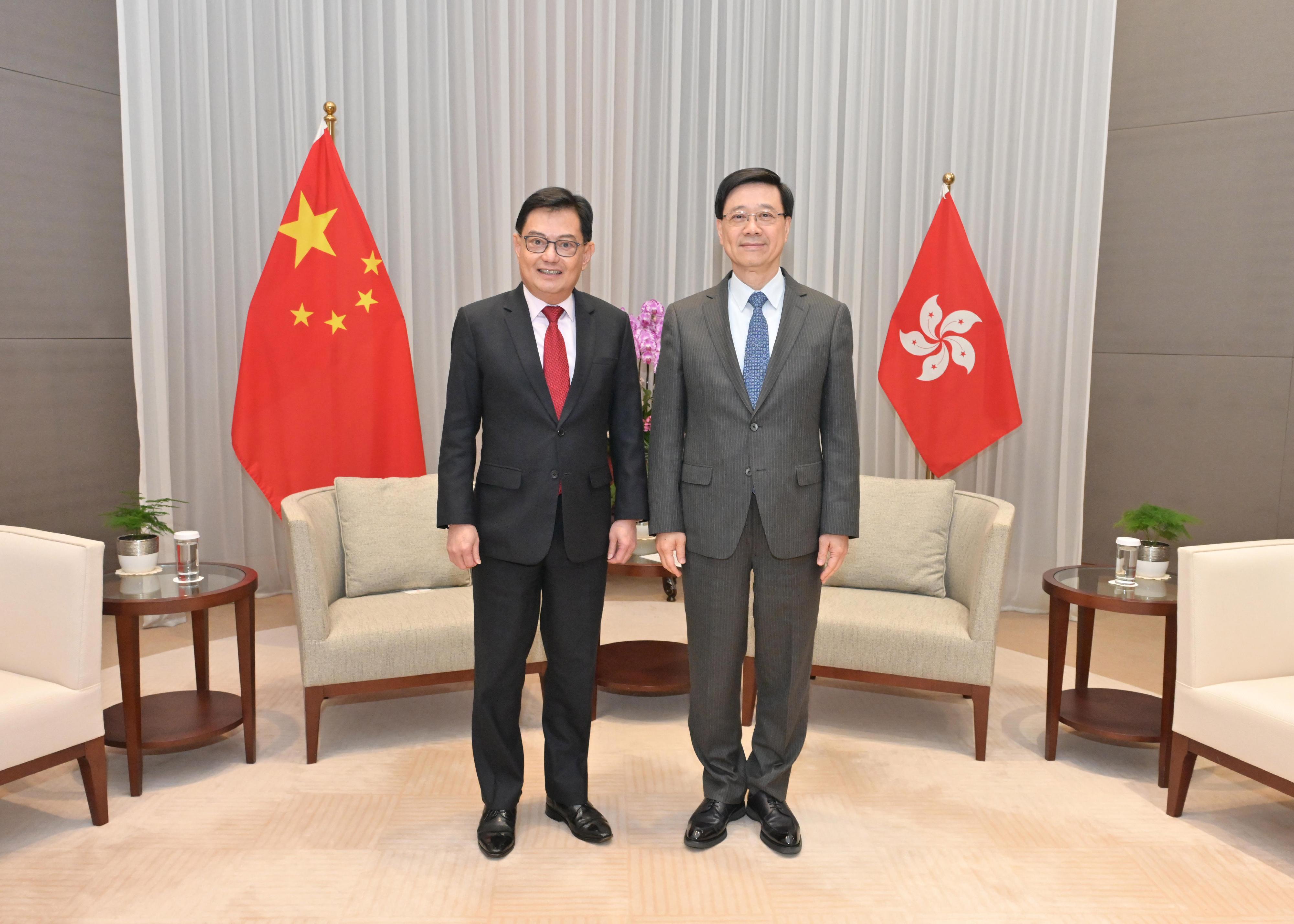 The Chief Executive, Mr John Lee (right), today (April 12) meets with the Deputy Prime Minister and Coordinating Minister for Economic Policies of Singapore, Mr Heng Swee Keat (left).