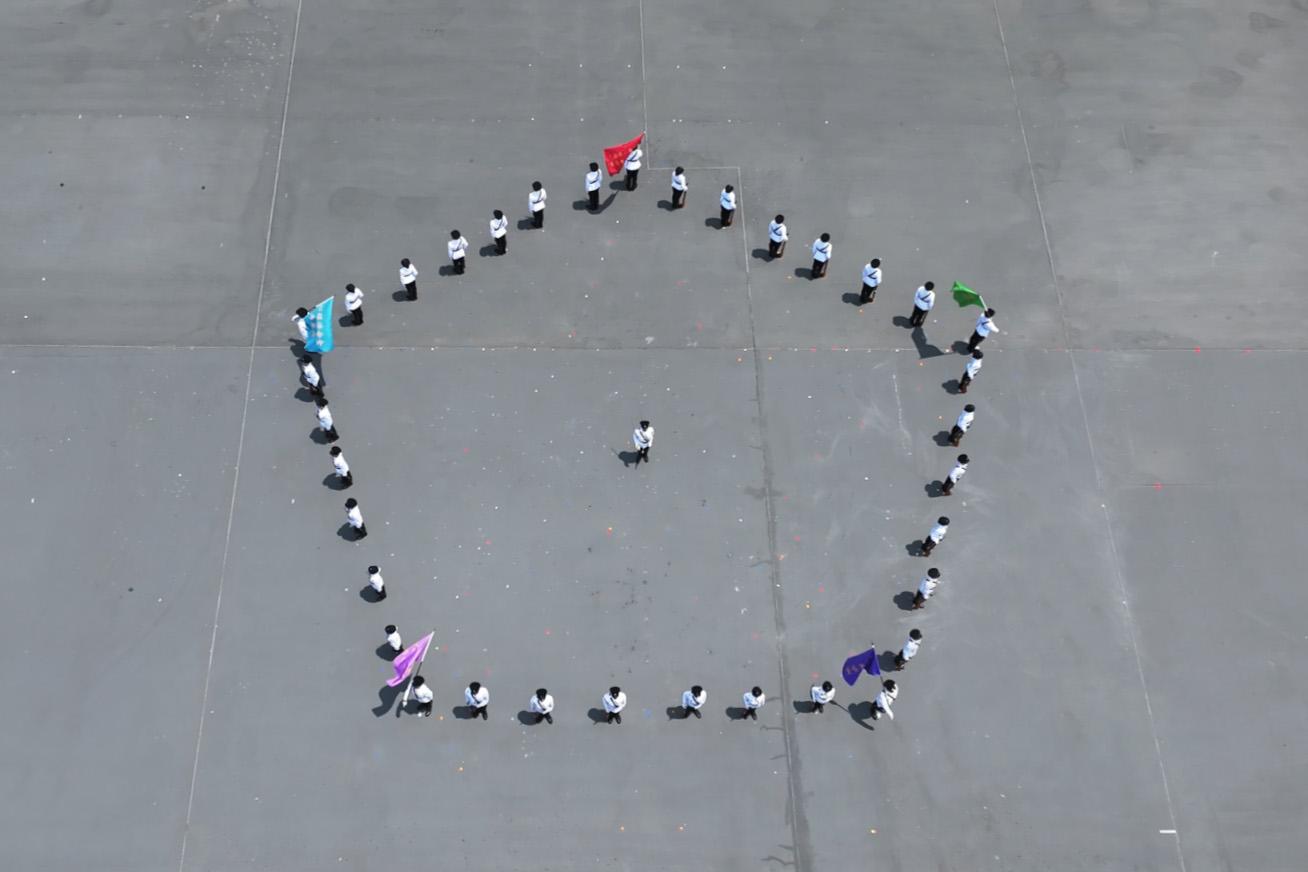 To support the National Security Education Day, the Immigration Service Institute of Training and Development held an open day today (April 13). Photo shows the Departmental Contingent forming a pentagon to symbolise the Five Co-ordination Tasks of the Holistic Approach to National Security.