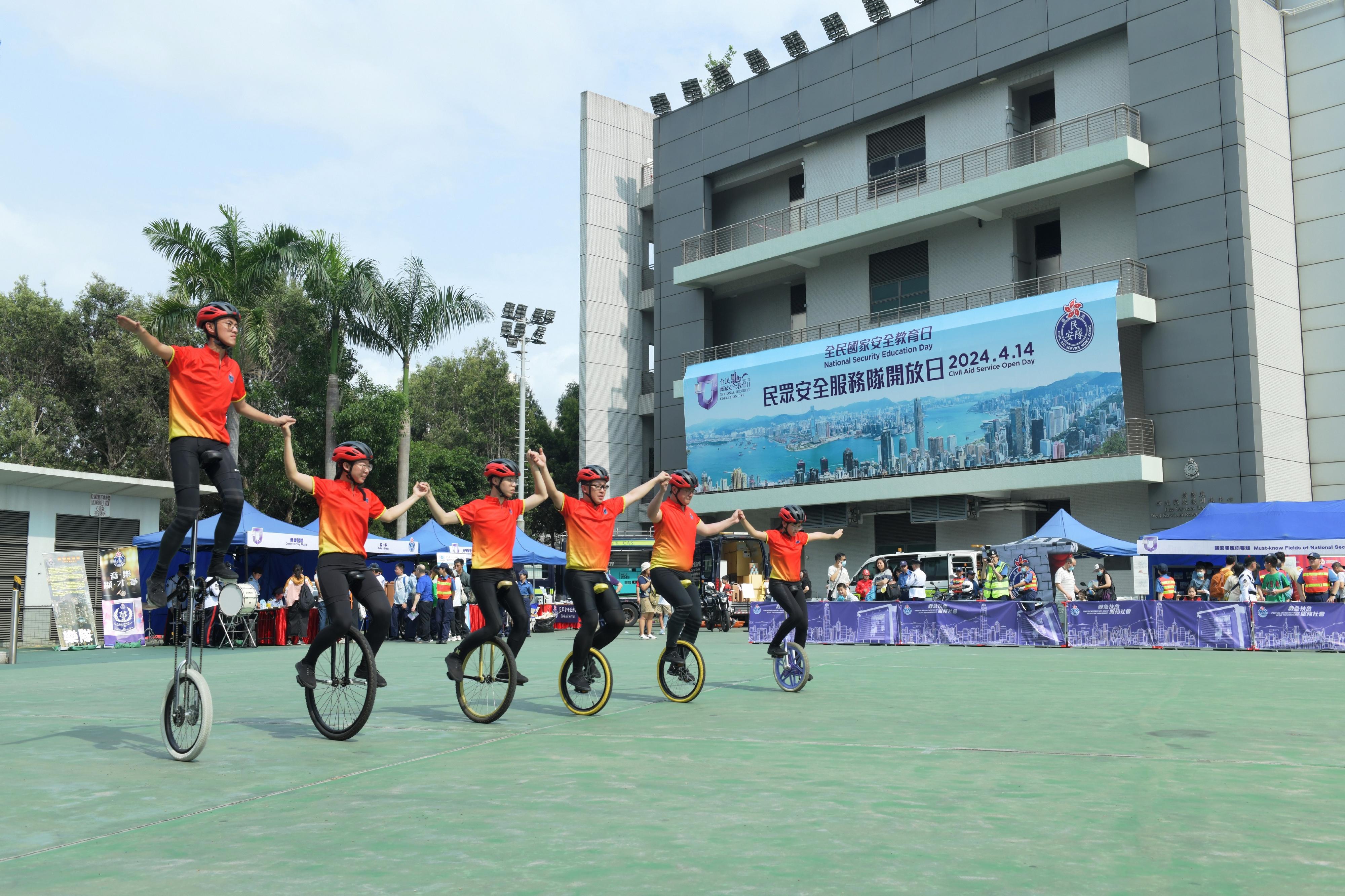 The Civil Aid Service (CAS) held an open day at its headquarters today (April 14) to promote the National Security Education Day. Photo shows bicycle performance from CAS Cadet Corps.