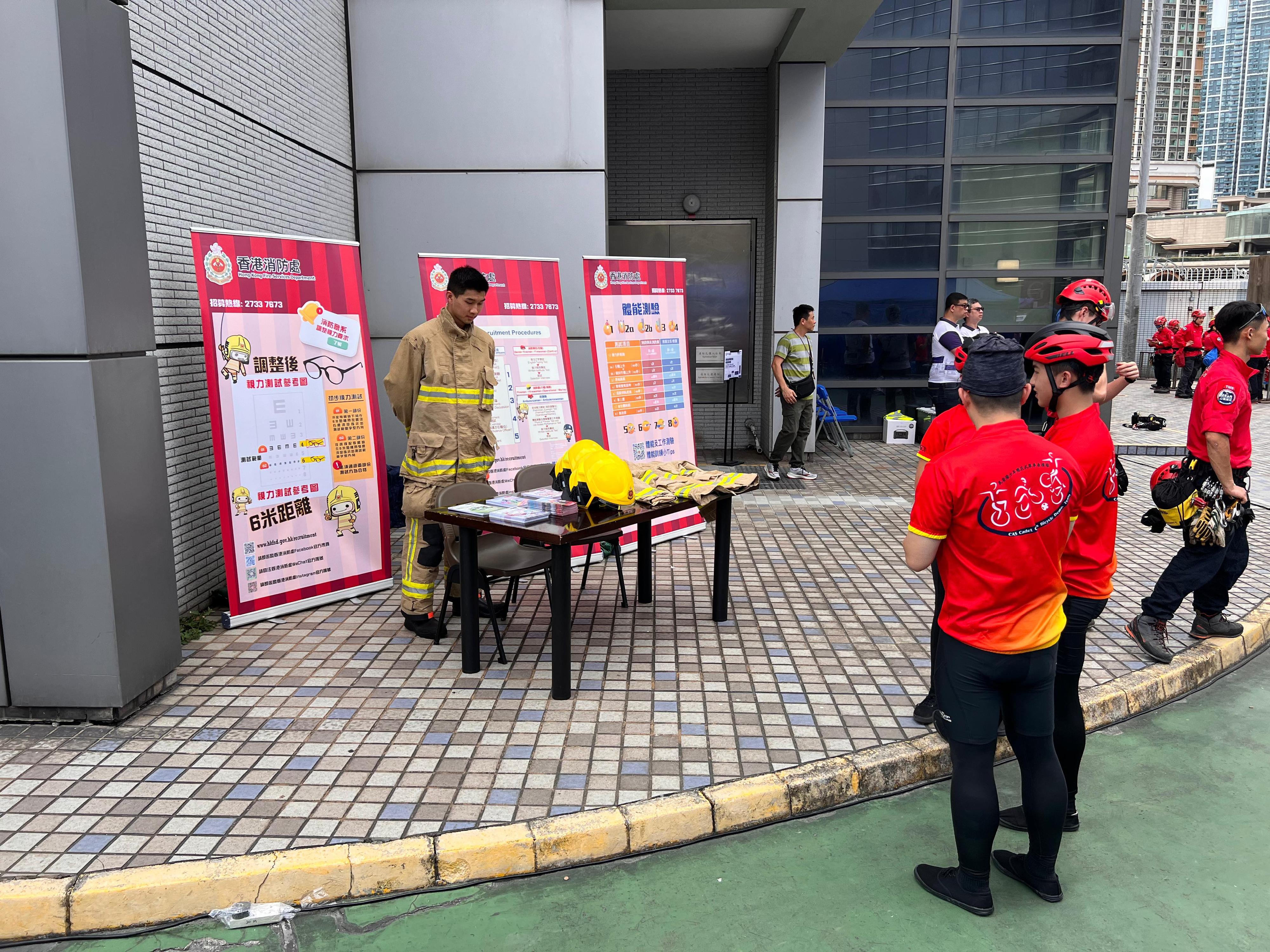 The Civil Aid Service held an open day at its headquarters today (April 14) to promote the National Security Education Day. Photo shows members of public visiting the Simulated Tunnel and Chute Training Chamber of the Fire Services Department.