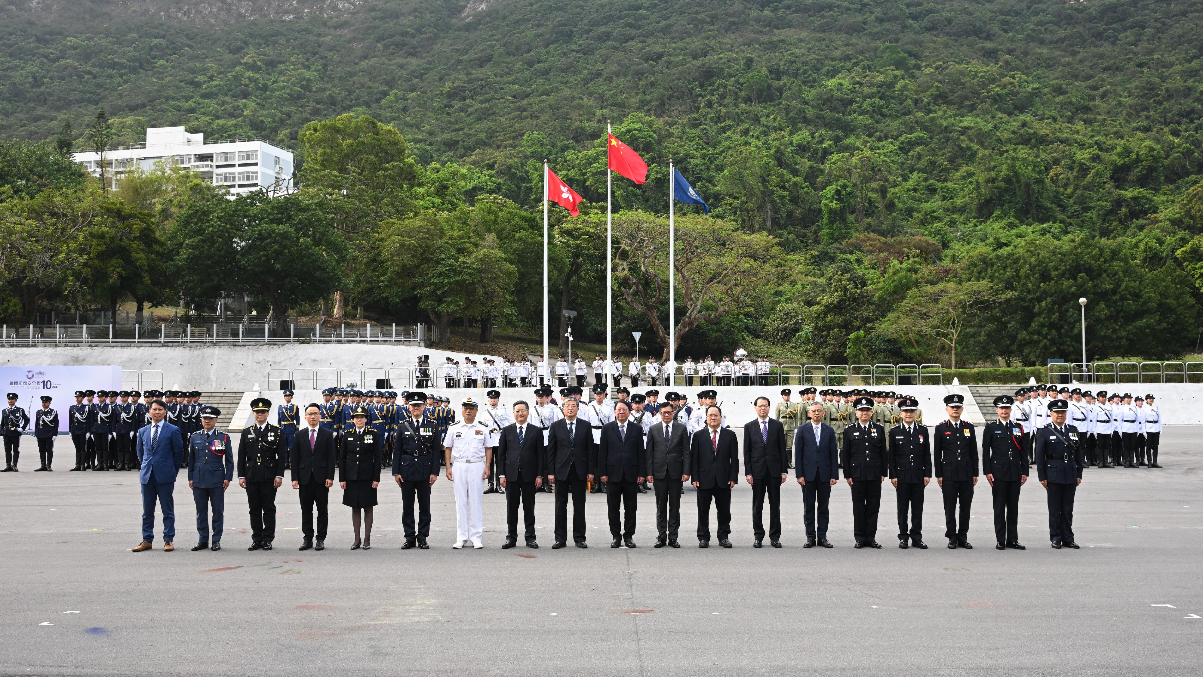 The Chief Secretary for Administration, Mr Chan Kwok-ki, attended the National Security Education Day flag raising ceremony today (April 15). Photo shows (from seventh left) the Deputy Chief of Staff of the Chinese People's Liberation Army Hong Kong Garrison, Senior Colonel Liu Zhaohui; Deputy Head of the Office for Safeguarding National Security of the Central People's Government in the Hong Kong Special Administrative Region (HKSAR) Mr Li Jiangzhou; Deputy Director of the Liaison Office of the Central People's Government in the HKSAR Mr Luo Yonggang; Mr Chan; the Secretary for Security, Mr Tang Ping-keung; Deputy Commissioner of the Office of the Commissioner of the Ministry of Foreign Affairs of the People's Republic of China in the HKSAR Mr Pan Yundong; the Secretary General of the Committee for Safeguarding National Security of the HKSAR, Mr Sonny Au; and heads of disciplined services departments and other officiating guests at the ceremony.